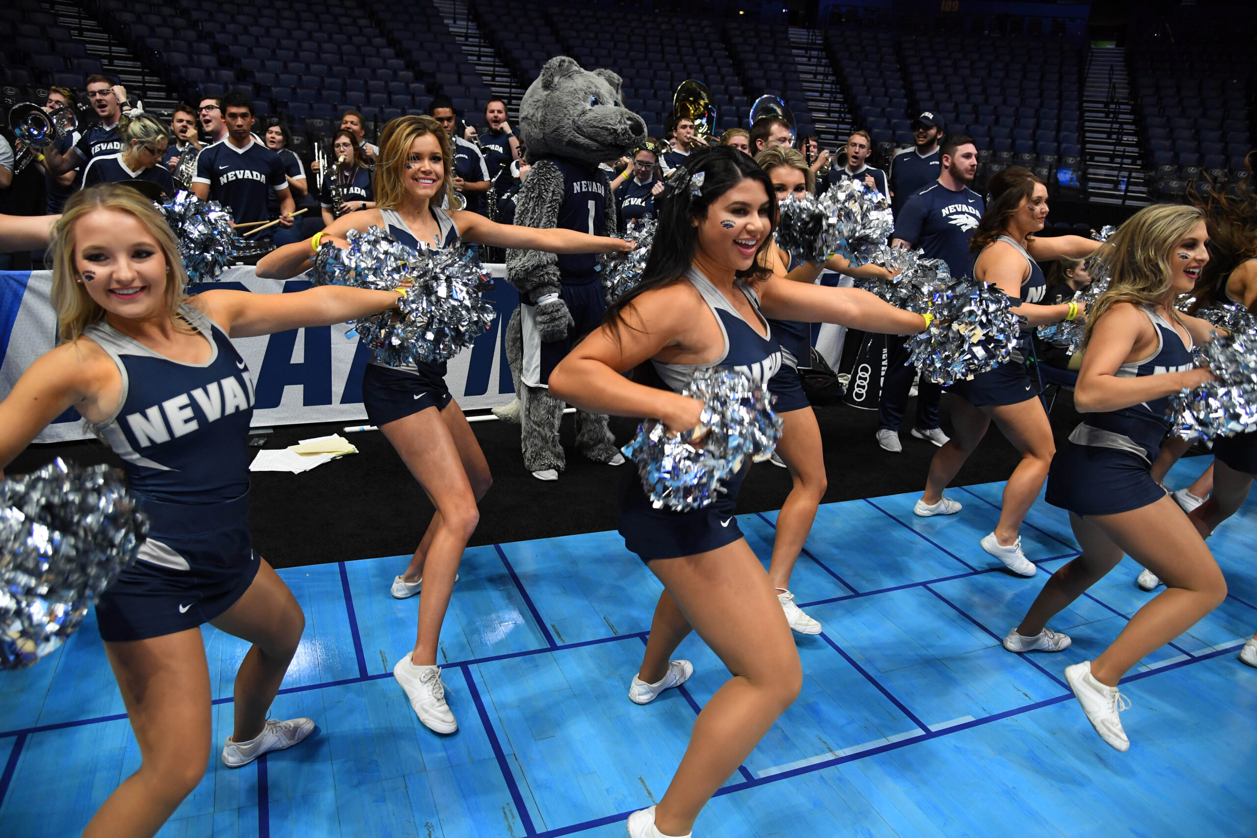 Mar 15, 2018; Nashville, TN, USA; The Nevada Wolf Pack cheerleaders perform during practice the day before the first round of the 2018 NCAA Tournament at Bridgestone Arena. Mandatory Credit: Christopher Hanewinckel-Imagn Images