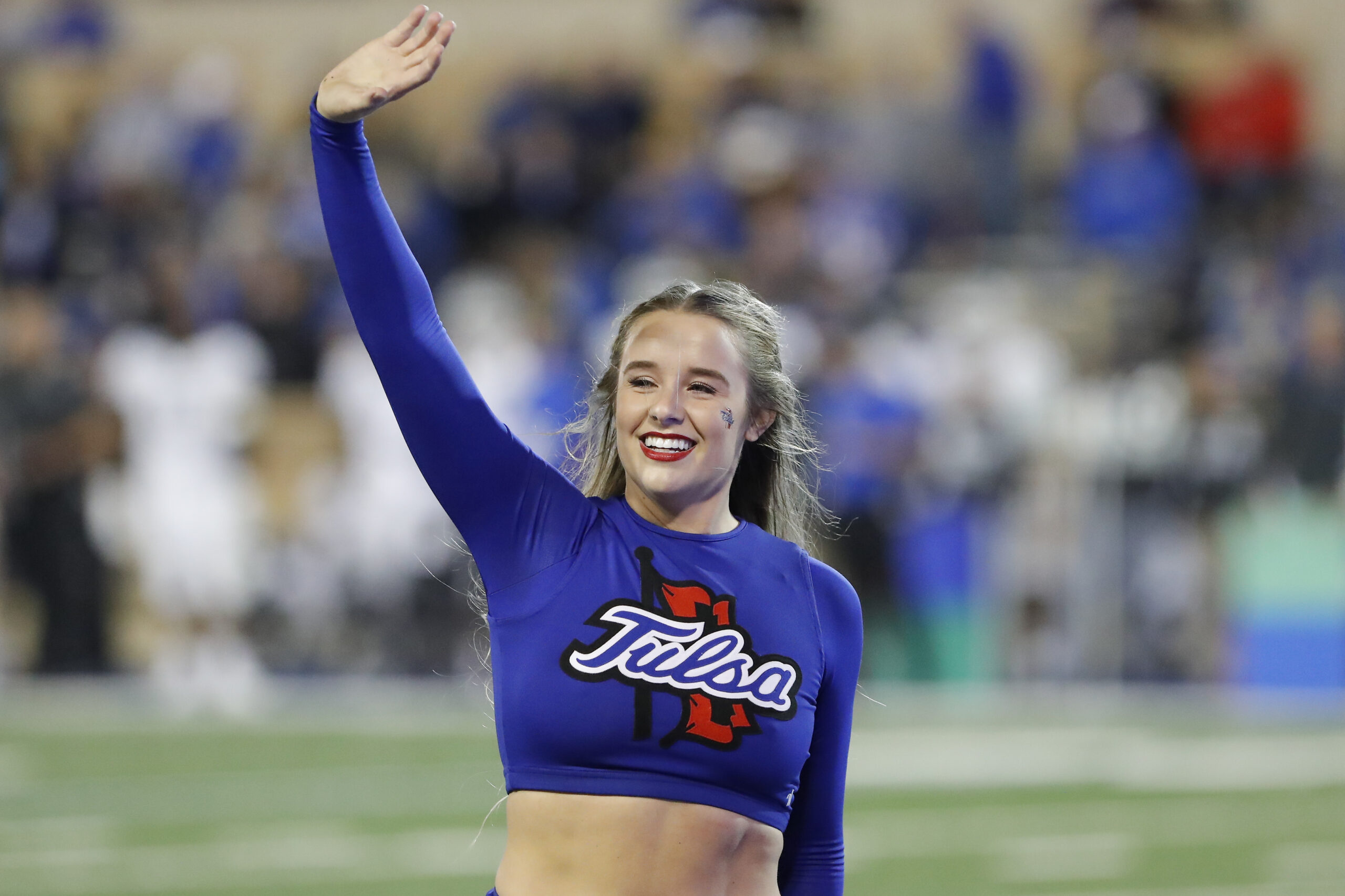 Oct 26, 2019; Tulsa, OK, USA; Tulsa Golden Hurricane cheerleader waves to fans during a time out in the second quarter against the Memphis Tigers at Skelly Field at H.A. Chapman Stadium. Mandatory Credit: Alonzo Adams-Imagn Images