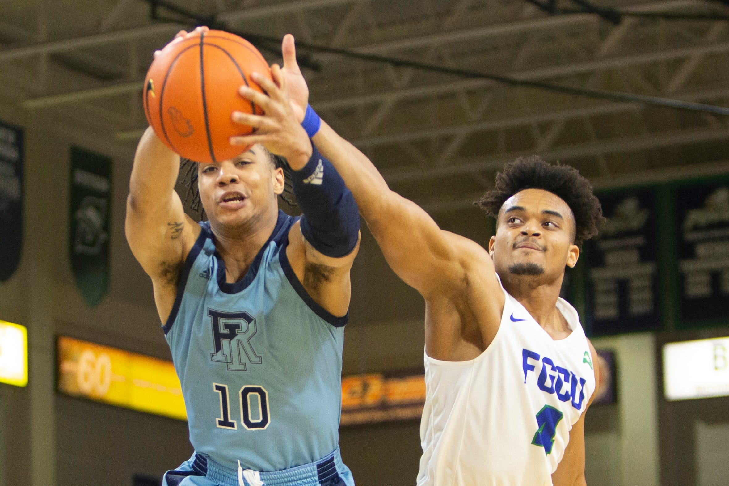 Rhode Island Rams guard Ishmael Leggett (10) grabs a rebound against Florida Gulf Coast Eagles guard Cyrus Largie (4) uring the second half of the NCAA men   s basketball game between the Rhode Island Rams and the Florida Gulf Coast Eagles, Tuesday, Nov. 23, 2021, at Alico Arena in Fort Myers, Fla. FGCU defeated Rhode Island 67-66.

Rhode Island at Florida Gulf Coast men's basketball