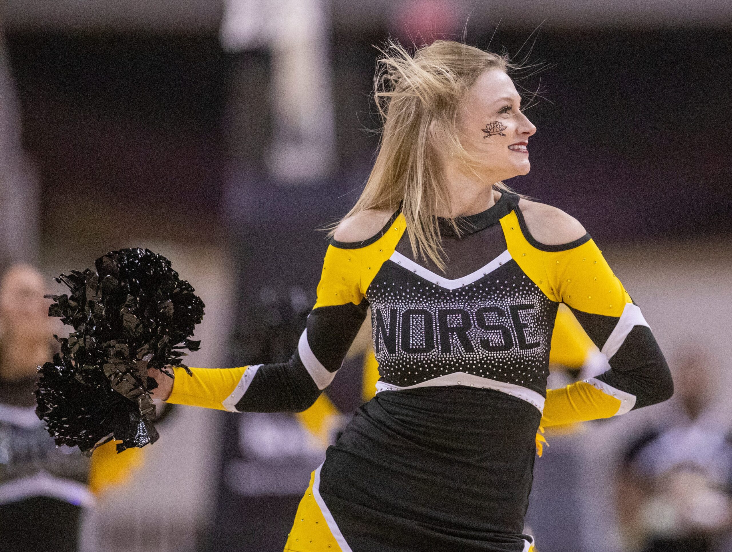 A Northern Kentucky Norse cheerleader works through a timeout, Monday, March 7, 2022, during Horizon League tournament men s semifinal action from Indianapolis Indiana Farmers Coliseum. NKU won 57-43.