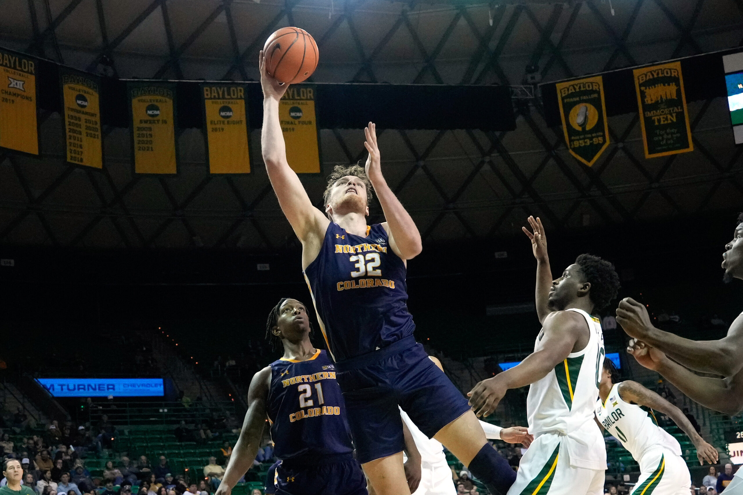Nov 14, 2022; Waco, Texas, USA; Northern Colorado Bears center Theo Hughes (32) shoots against Baylor Bears guard Adam Flagler (10) during the first half at Ferrell Center. Mandatory Credit: Chris Jones-Imagn Images
