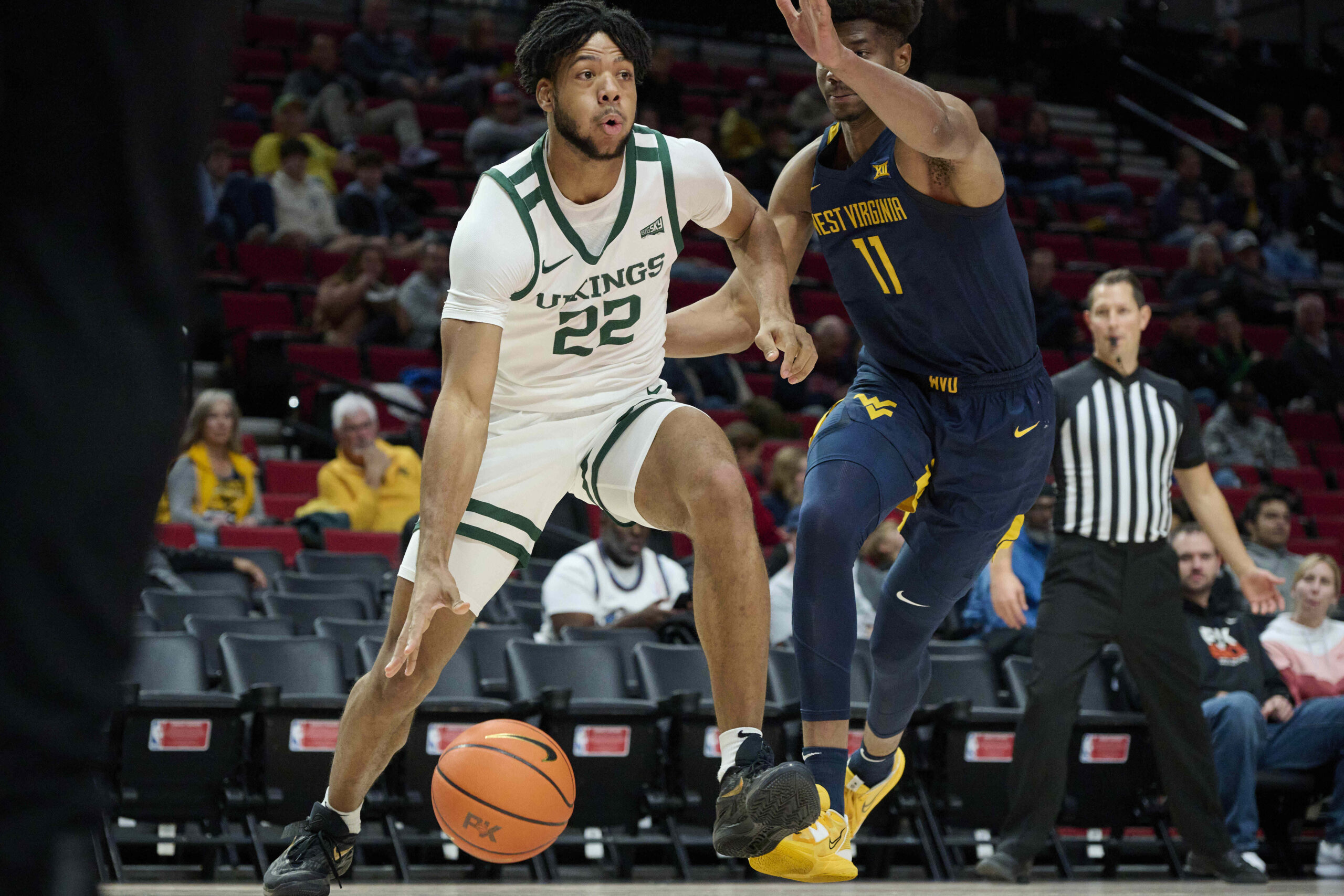 Nov 25, 2022; Portland, Oregon, USA; Portland State Vikings forward Isaiah Johnson (22) drives to the basket during the first half against West Virginia Mountaineers forward Mohamed Wague (11) at Moda Center. Mandatory Credit: Troy Wayrynen-Imagn Images