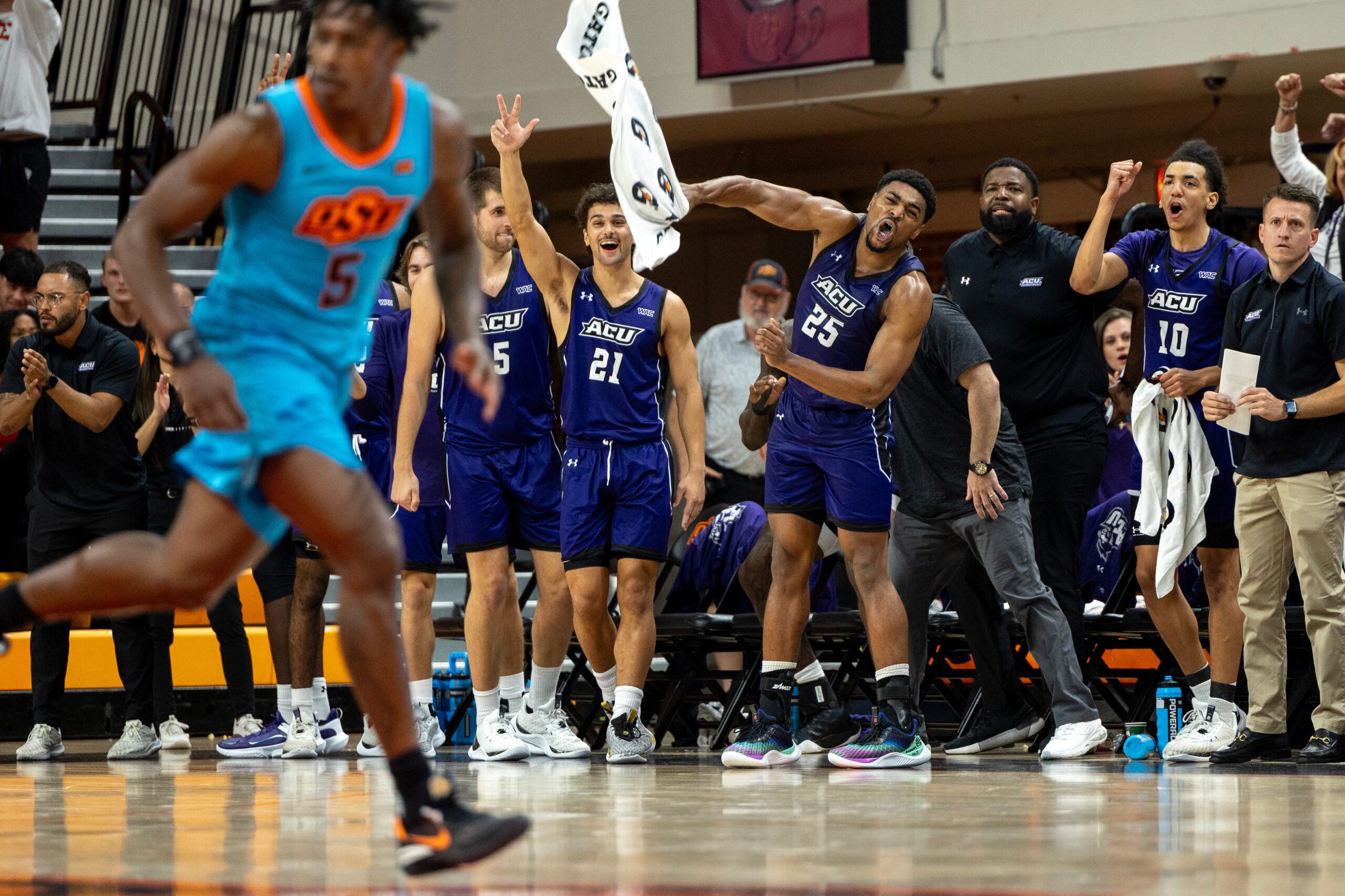 Abilene Christian forward Cameron Steele (5), guard Hunter Jack Madden (21), guard Immanuel Allen (25) and guard Nasir DeGruy (10) celebrate on the second half of an NCAA men s college basketball game Monday, Nov. 6, 2023., in Stillwater, Okla. (Mitch Alcala for the Oklahoman)