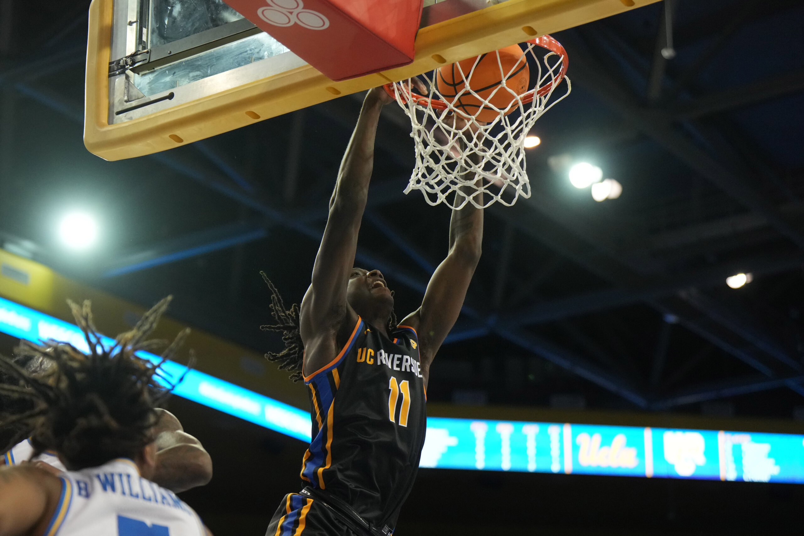 sNov 30, 2023; Los Angeles, California, USA; UC Riverside Highlanders guard Nate Pickens (11) dunks the ball against the UCLA Bruins in the first half at Pauley Pavilion presented by Wescom. Mandatory Credit: Kirby Lee-Imagn Images