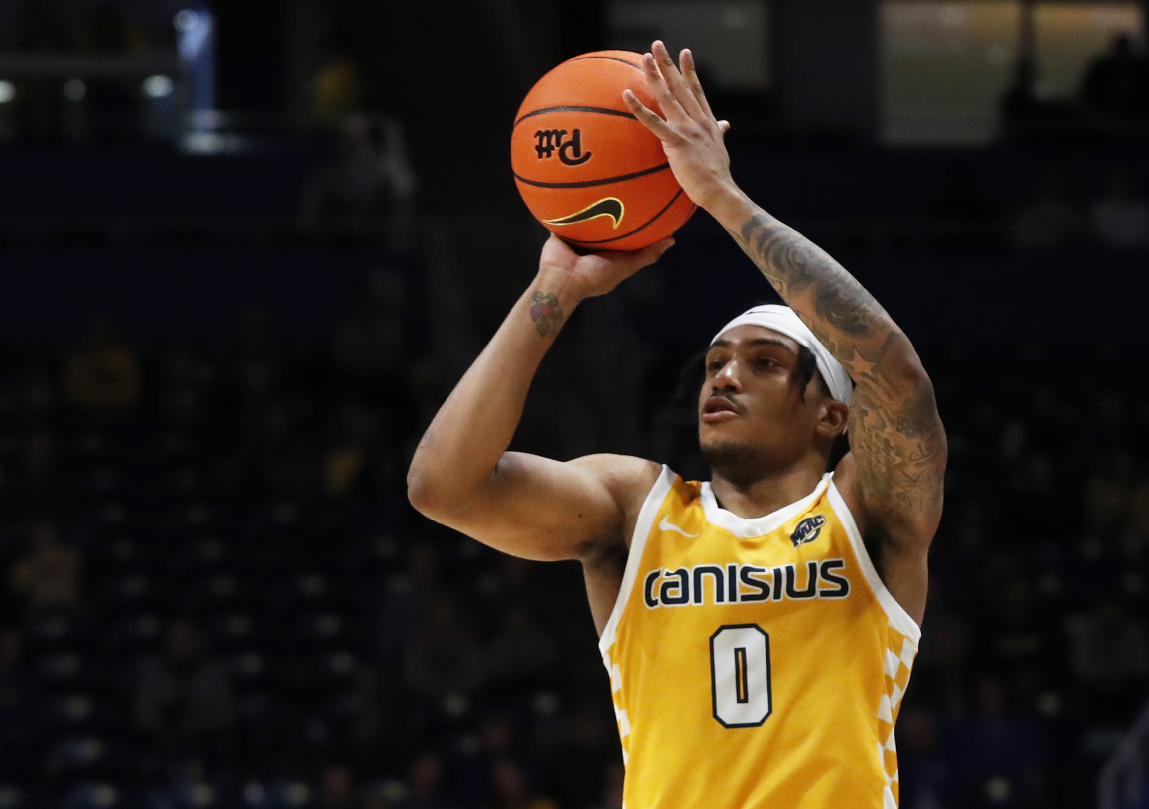 Dec 9, 2023; Pittsburgh, Pennsylvania, USA; Canisius Golden Griffins guard Tre Dinkins (0) shoots against the Pittsburgh Panthers during the second half at the Petersen Events Center. Pittsburgh won 82-71. Mandatory Credit: Charles LeClaire-Imagn Images
