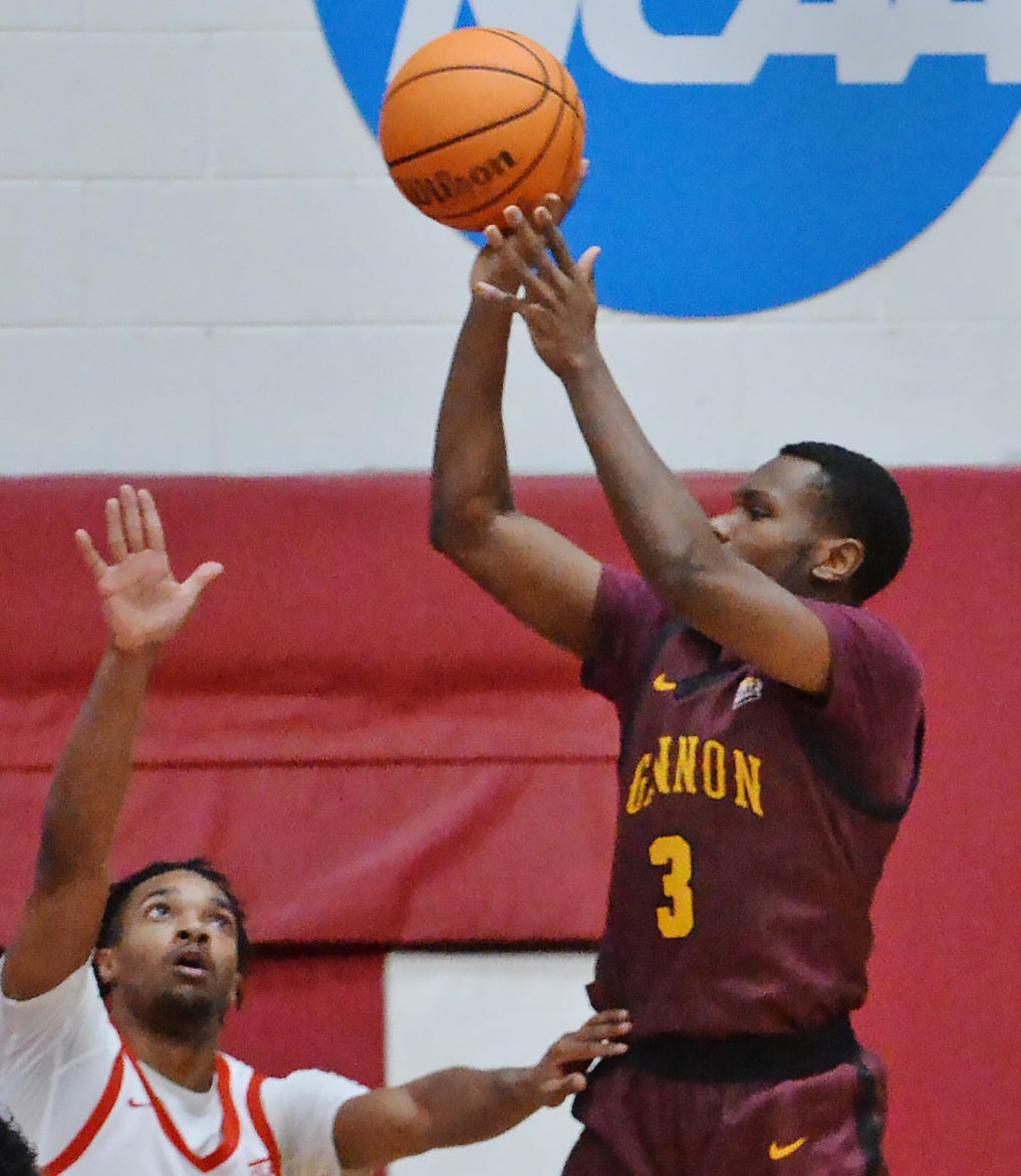 Gannon University junior Derrick Anderson, right, shoots near Edinboro University junior Bernie Blunt during a men's basketball game in Edinboro on Jan. 10, 2024.
