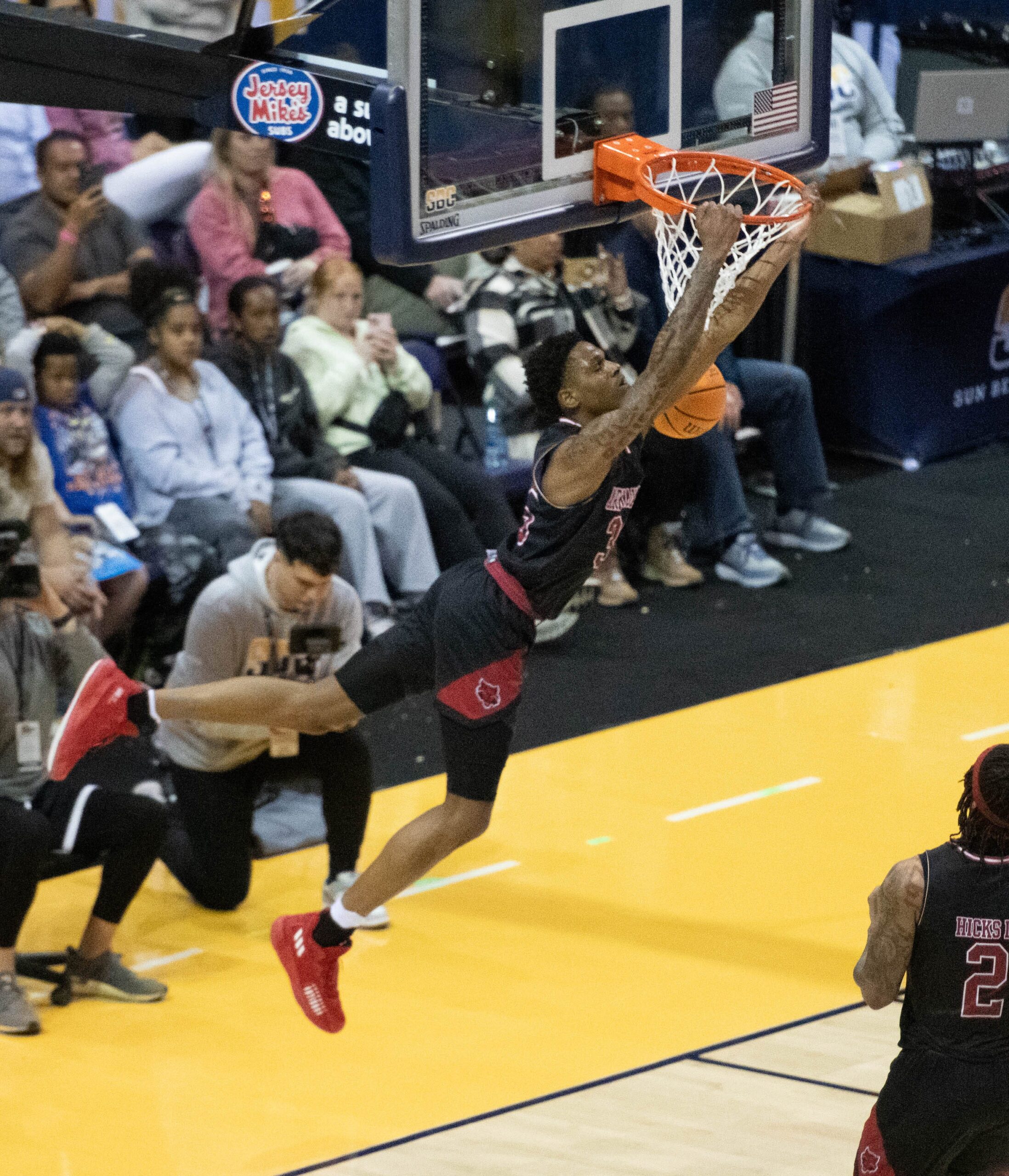 Izaiyah Nelson (35) dunks during the Arkansas State vs James Madison basketball game in the finals of the Sun Belt Conference Men's Basketball Championship at the Pensacola Bay Center in Pensacola, Florida, on Monday, March 11, 2024. The Dukes defeated the Red Wolves 91 - 71.