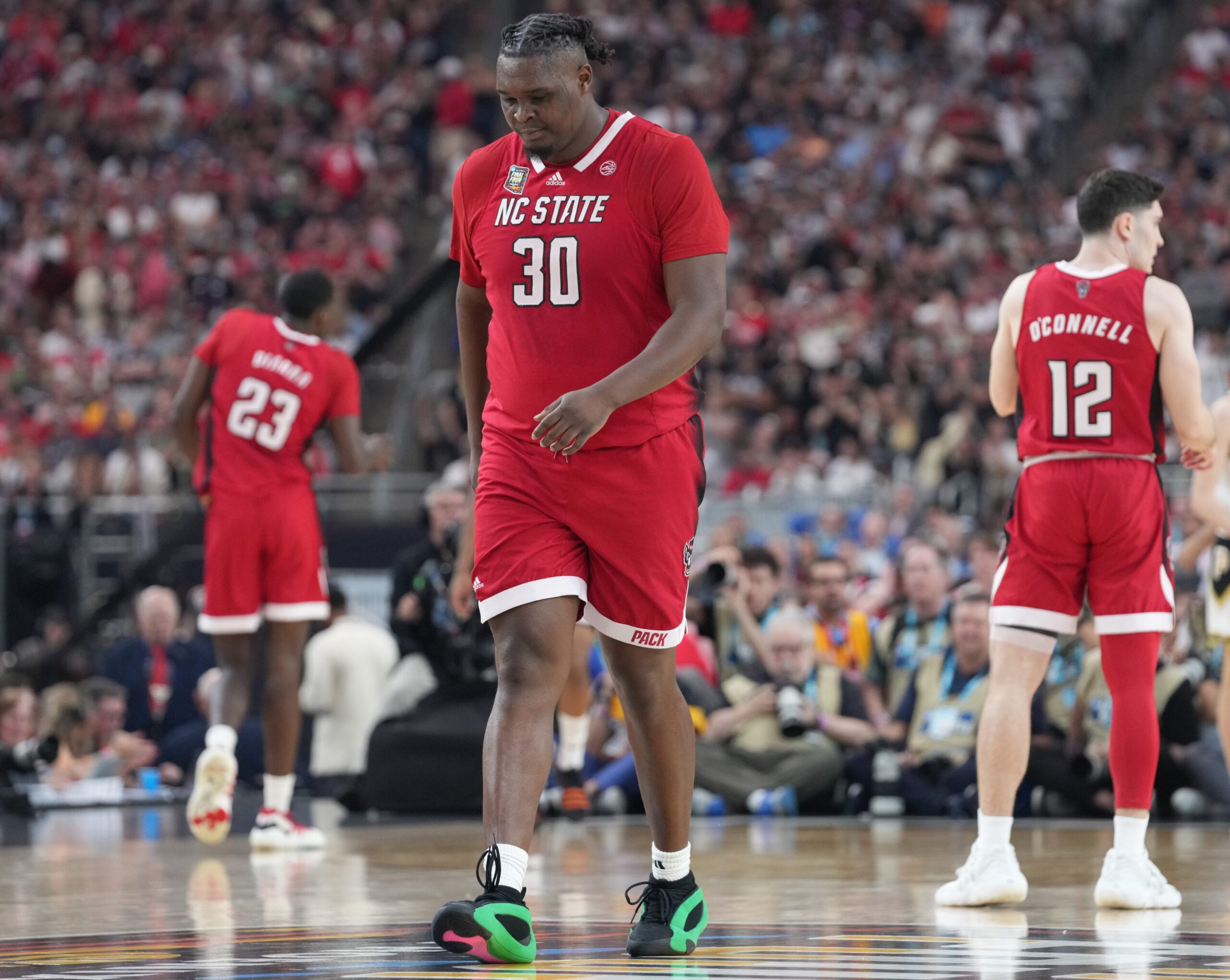 North Carolina State Wolfpack forward DJ Burns Jr. (30) walks back down court during the NCAA MenÃ¢â‚¬â„¢s Basketball Tournament Final Four game against the Purdue Boilermakers, Saturday, April 6, 2024, at State Farm Stadium in Glendale, Ariz.