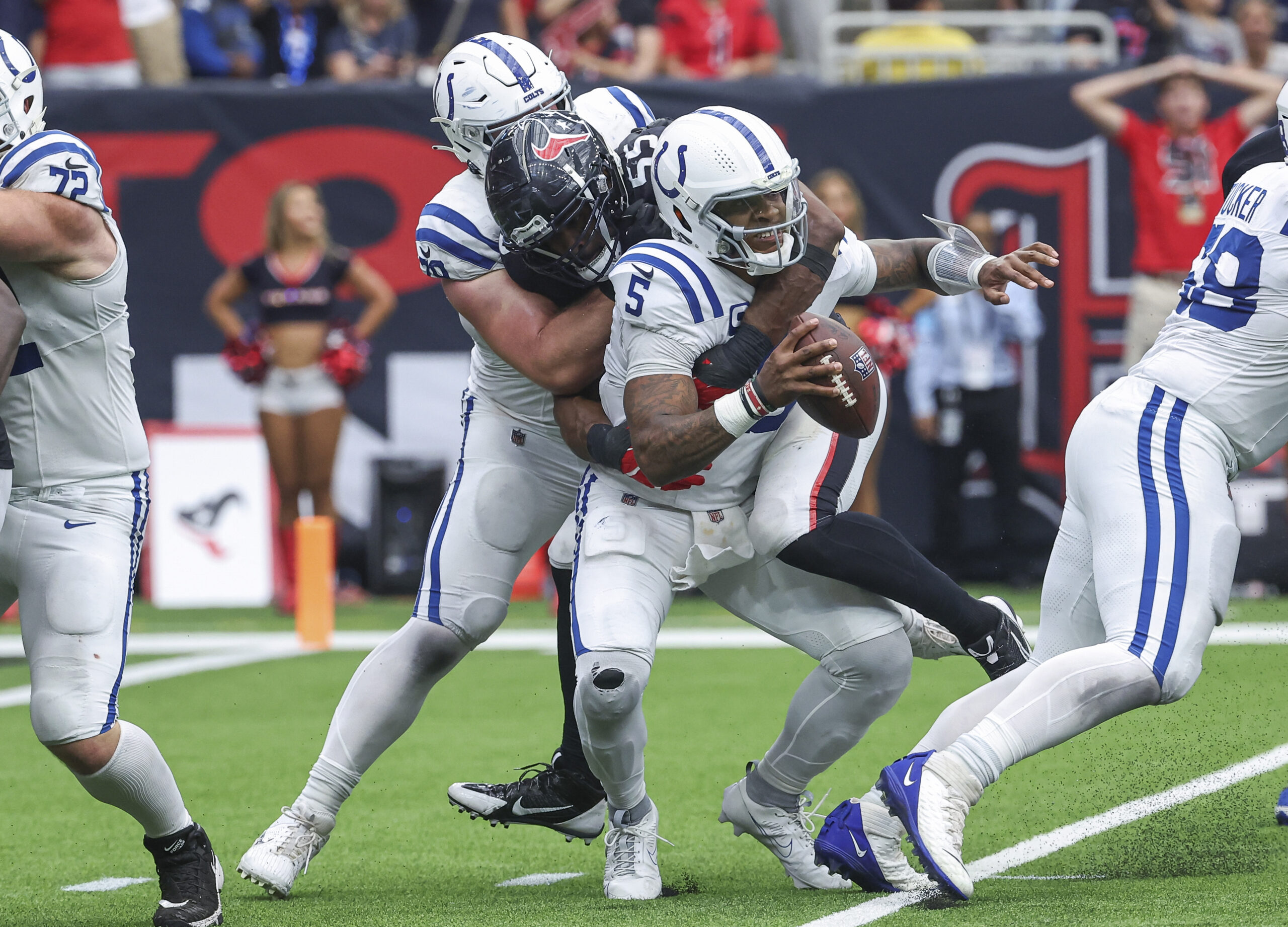 Oct 27, 2024; Houston, Texas, USA; Houston Texans defensive end Danielle Hunter (55) sacks Indianapolis Colts quarterback Anthony Richardson (5) during the fourth quarter at NRG Stadium. Mandatory Credit: Troy Taormina-Imagn Images