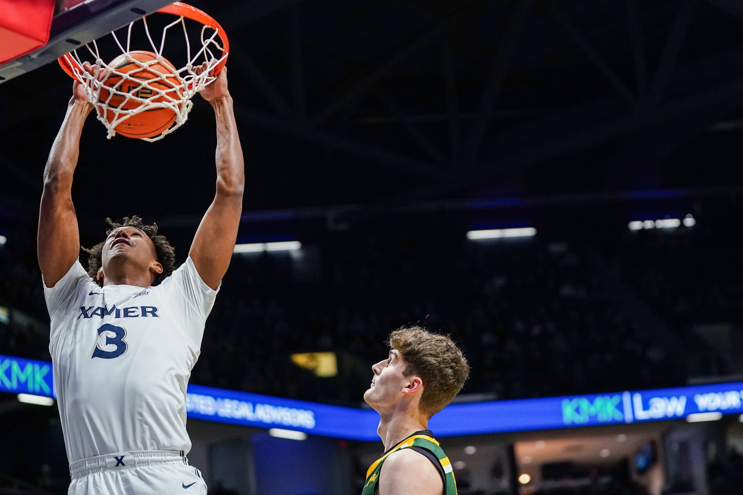 Xavier Musketeers guard Dailyn Swain (3) dunks the ball in the first half of a college basketball game between the Xavier Musketeers and Siena Saints, Wednesday, Nov. 20, 2024, at Cintas Center in Cincinnati.