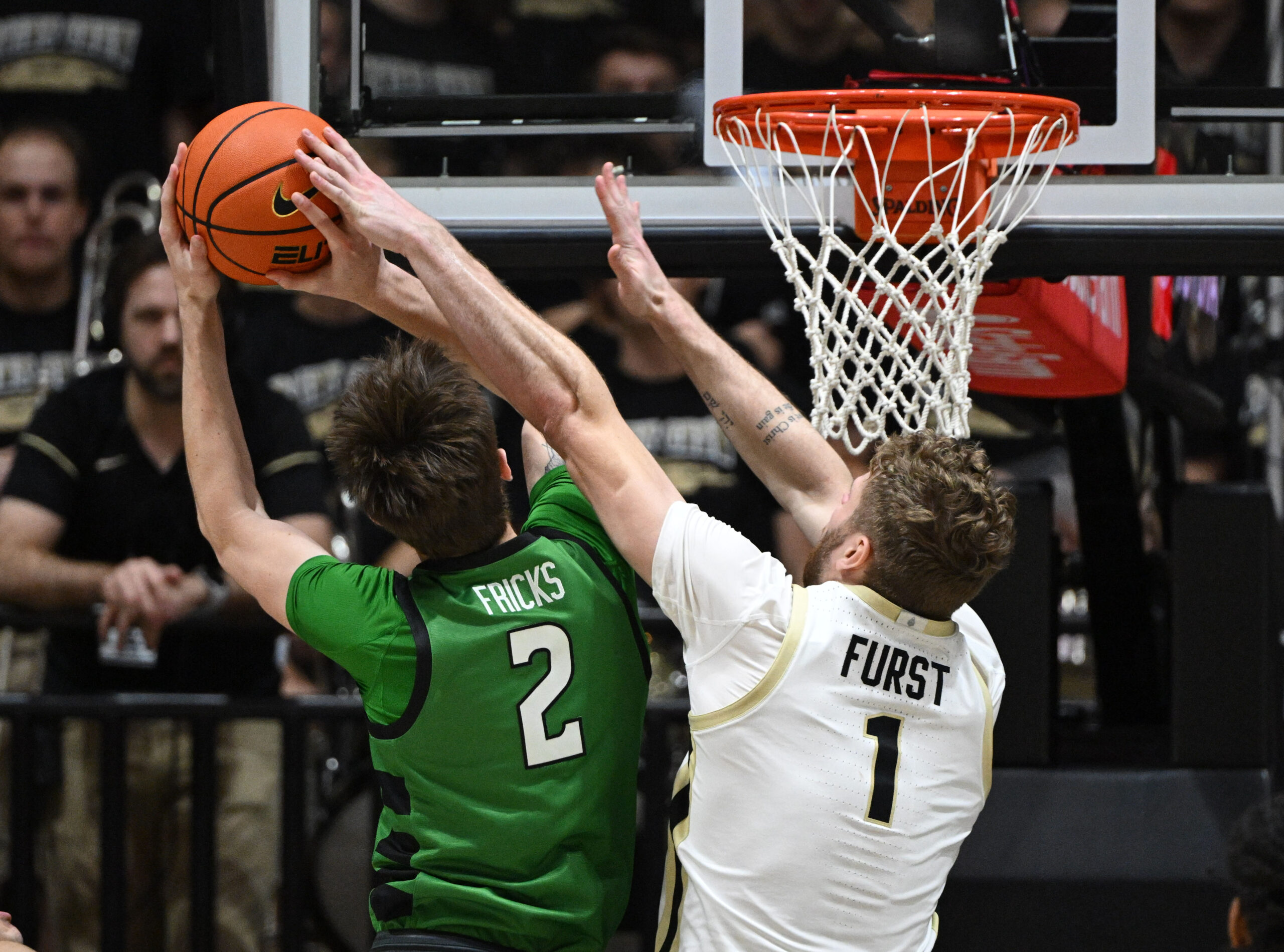 Nov 23, 2024; West Lafayette, Indiana, USA; Purdue Boilermakers forward Caleb Furst (1) blocks a shot by Marshall Thundering Herd forward Wyatt Fricks (2) during the second half at Mackey Arena. Mandatory Credit: Marc Lebryk-Imagn Images