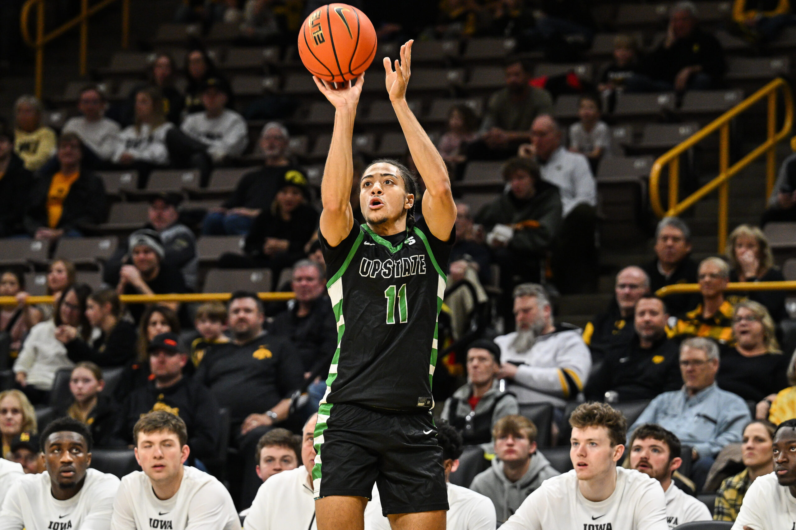Nov 26, 2024; Iowa City, Iowa, USA; USC Upstate Spartans guard Karmani Gregory (11) shoots the ball against the Iowa Hawkeyes during the first half at Carver-Hawkeye Arena. Mandatory Credit: Jeffrey Becker-Imagn Images