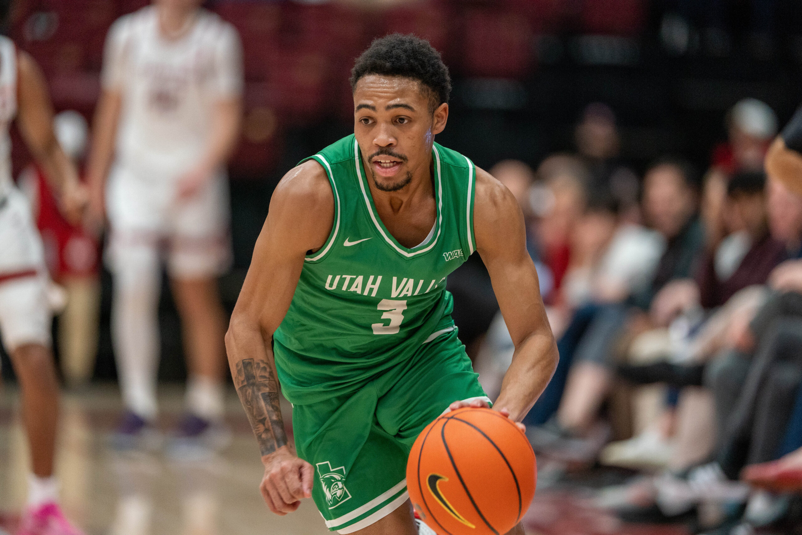 Dec 3, 2024; Stanford, California, USA; Utah Valley Wolverines guard Kylin Green (3) on a fast break to the basket against the Stanford Cardinal during the second half at Maples Pavilion. Mandatory Credit: Neville E. Guard-Imagn Images