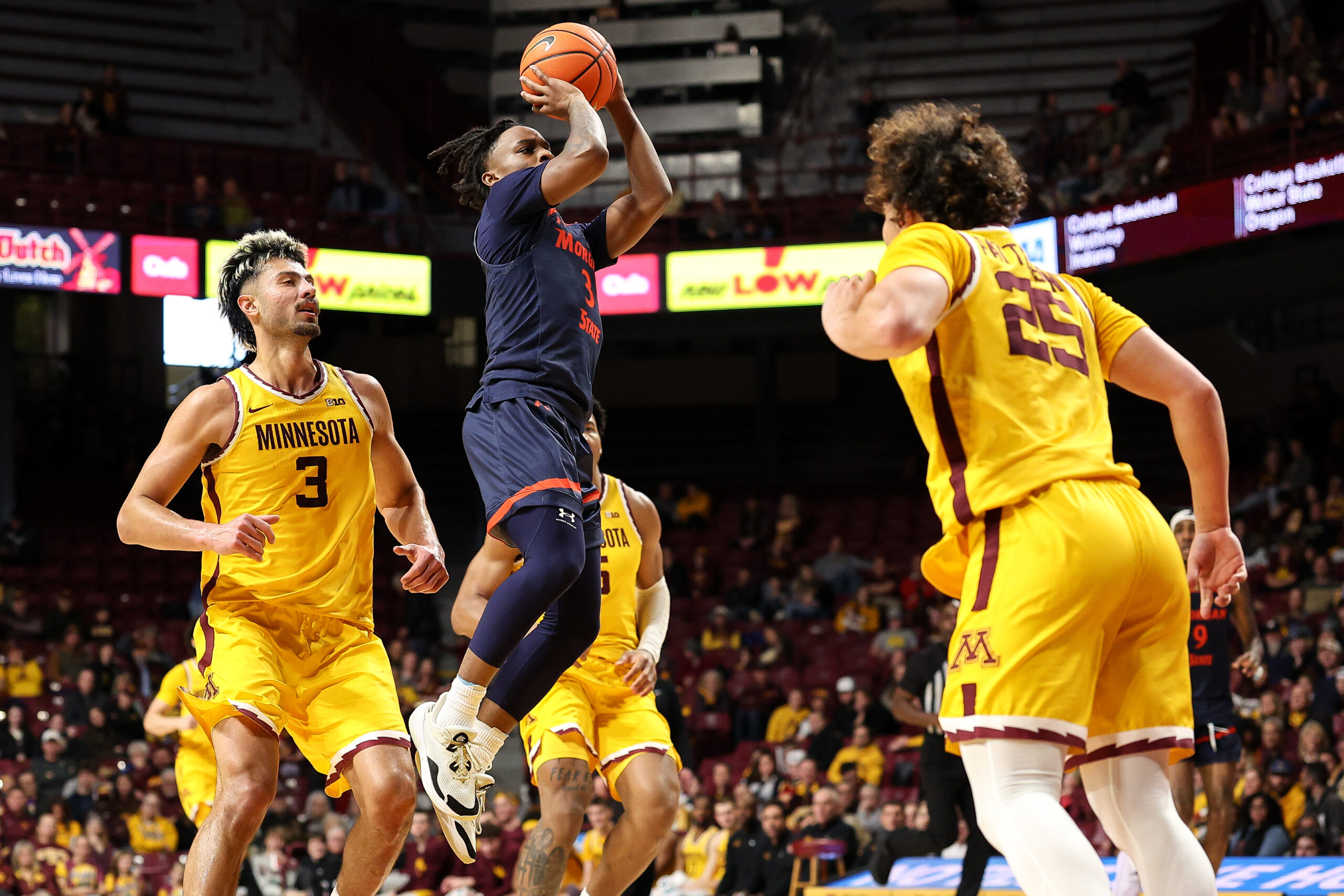 Dec 29, 2024; Minneapolis, Minnesota, USA; Morgan State Bears guard Rob Lawson (3) shoots against the Minnesota Golden Gophers during the second half at Williams Arena. Mandatory Credit: Matt Krohn-Imagn Images