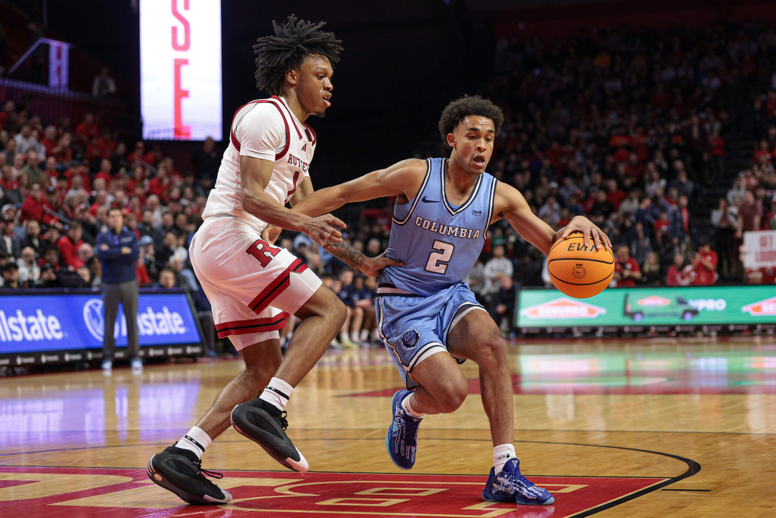 Dec 30, 2024; Piscataway, New Jersey, USA; Columbia Lions guard Kenny Noland (2) is guarded by Rutgers Scarlet Knights guard Jamichael Davis (1) during the first half at Jersey Mike's Arena. Mandatory Credit: Vincent Carchietta-Imagn Images