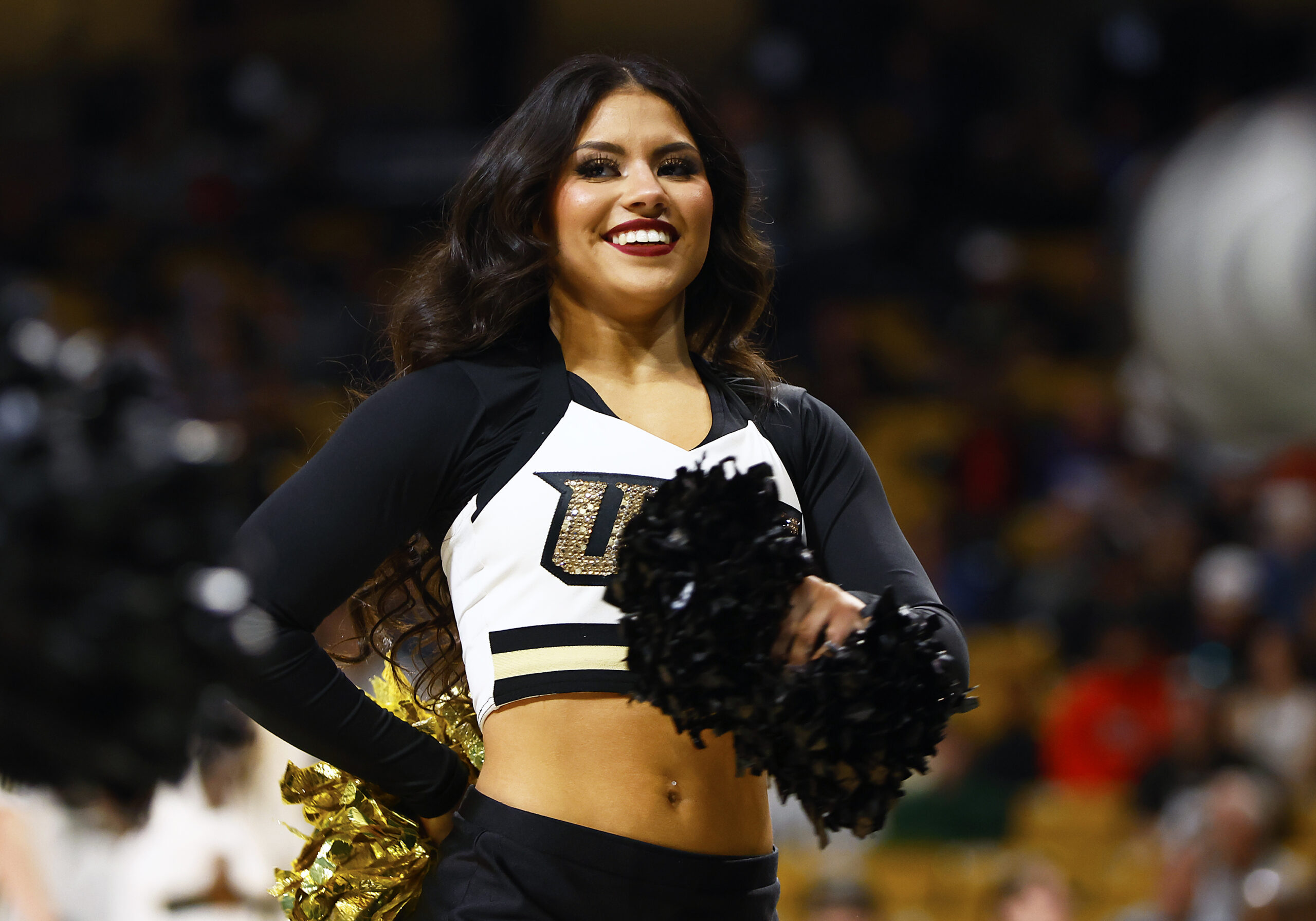 Jan 25, 2025; Orlando, Florida, USA; A Central Florida Knights cheerleader performs during a game against the Texas Christian Horned Frogs at Addition Financial Arena. Mandatory Credit: Russell Lansford-Imagn Images