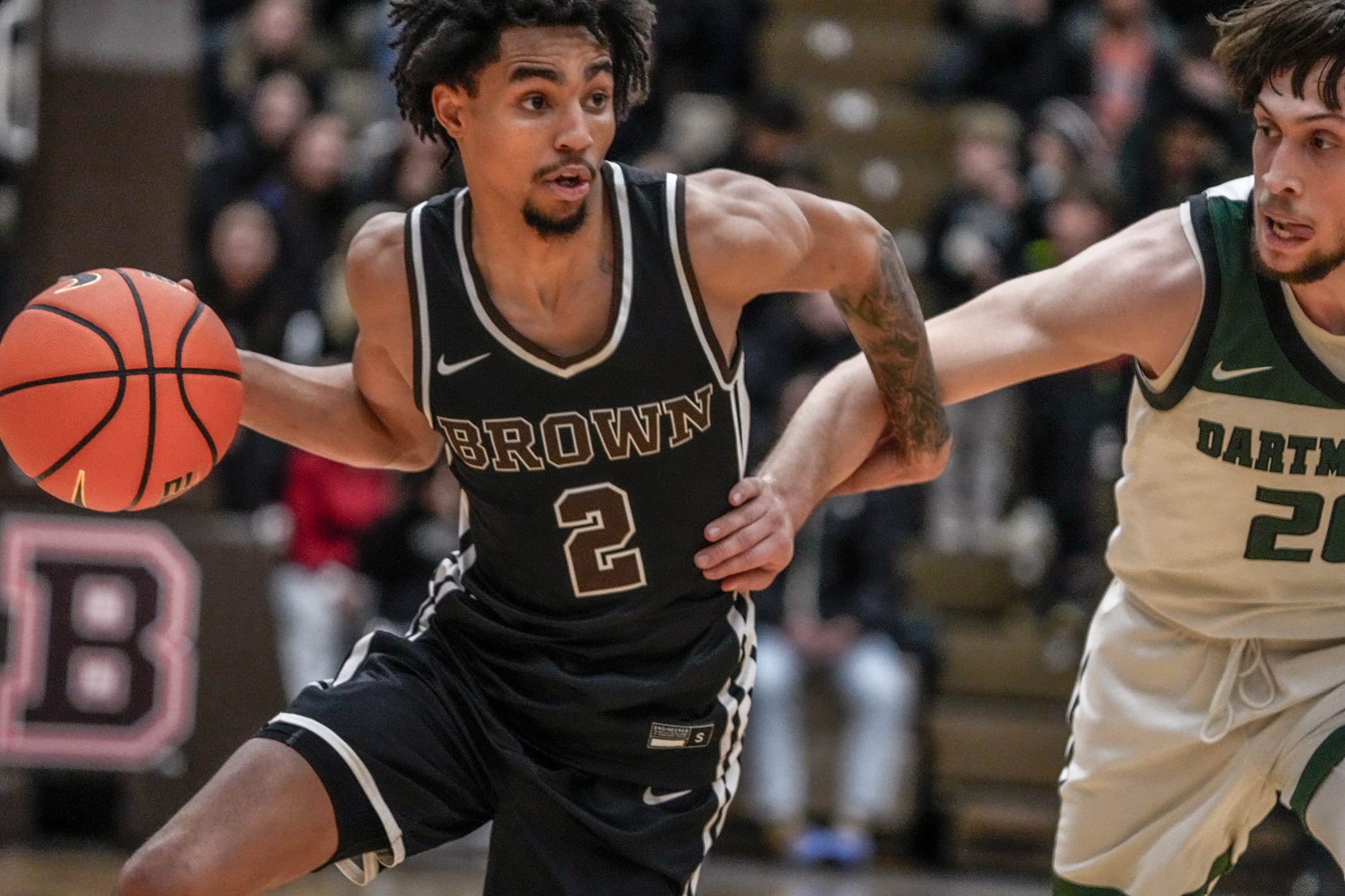 Brown falls to Dartmouth 84-83 at Pizzitola Sports Center. Bear's Jeremiah Jenkins drives by Romeo Myrthil