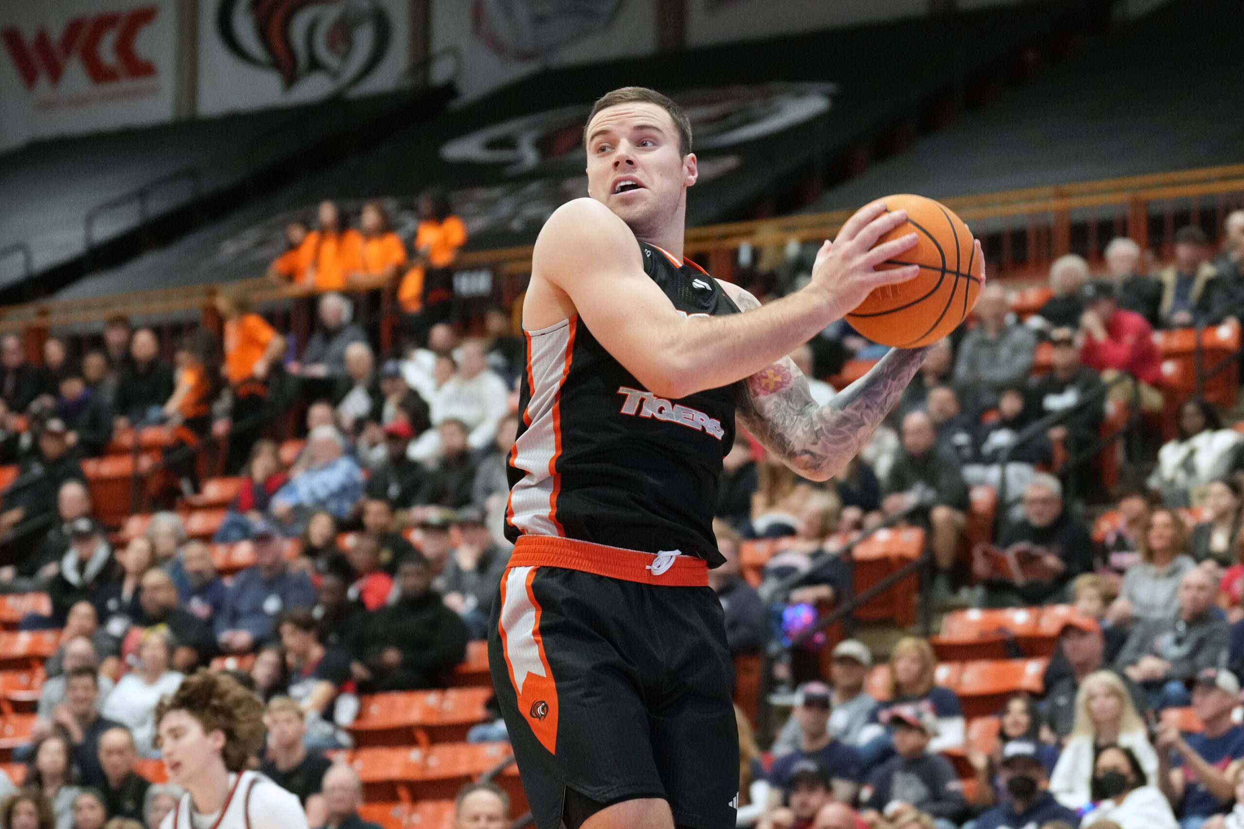 Feb 8, 2025; Stockton, California, USA; Pacific Tigers guard Petar Krivokapic (3) rebounds against the Gonzaga Bulldogs during the second half at Alex G. Spanos Center. Mandatory Credit: Darren Yamashita-Imagn Images
