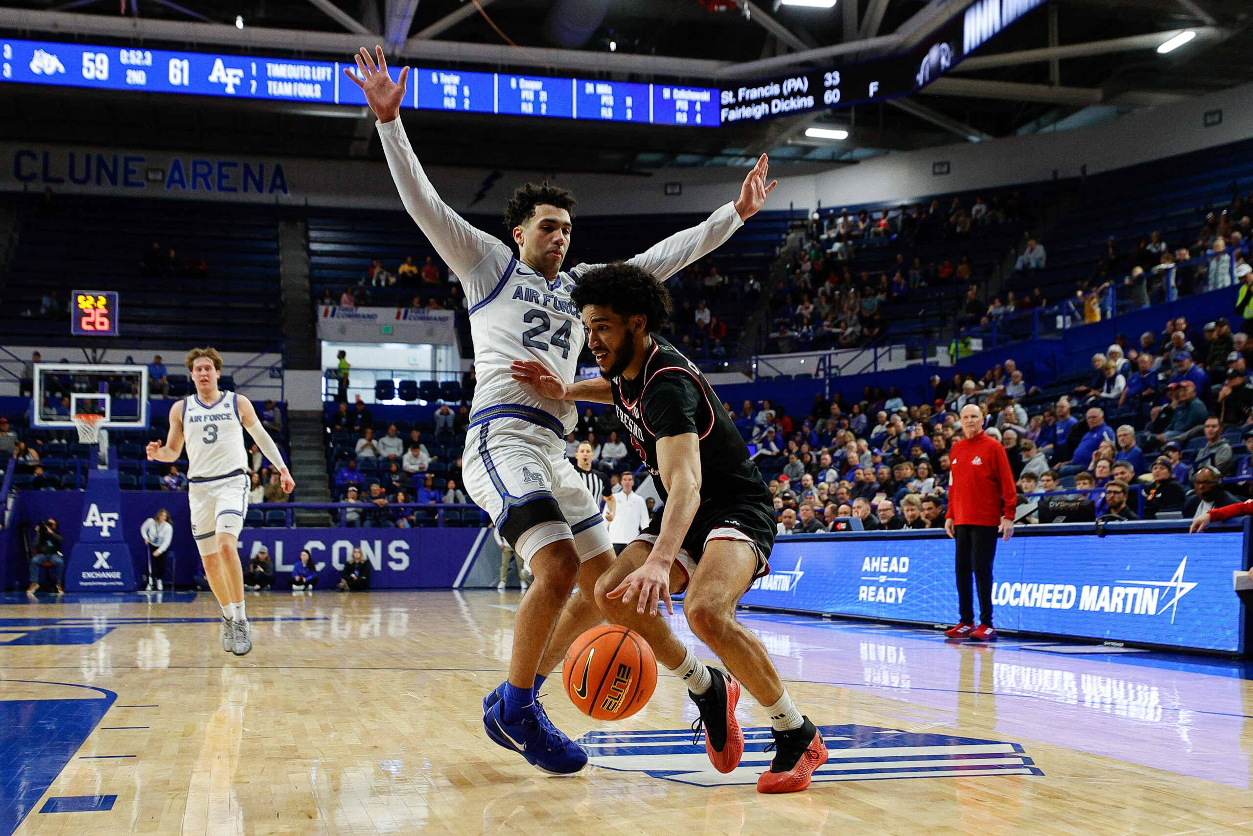 Feb 22, 2025; Colorado Springs, Colorado, USA; Fresno State Bulldogs forward Alex Crawford (8) controls the ball as Air Force Falcons guard Jeffrey Mills (24) guards in the second half at Clune Arena. Mandatory Credit: Isaiah J. Downing-Imagn Images