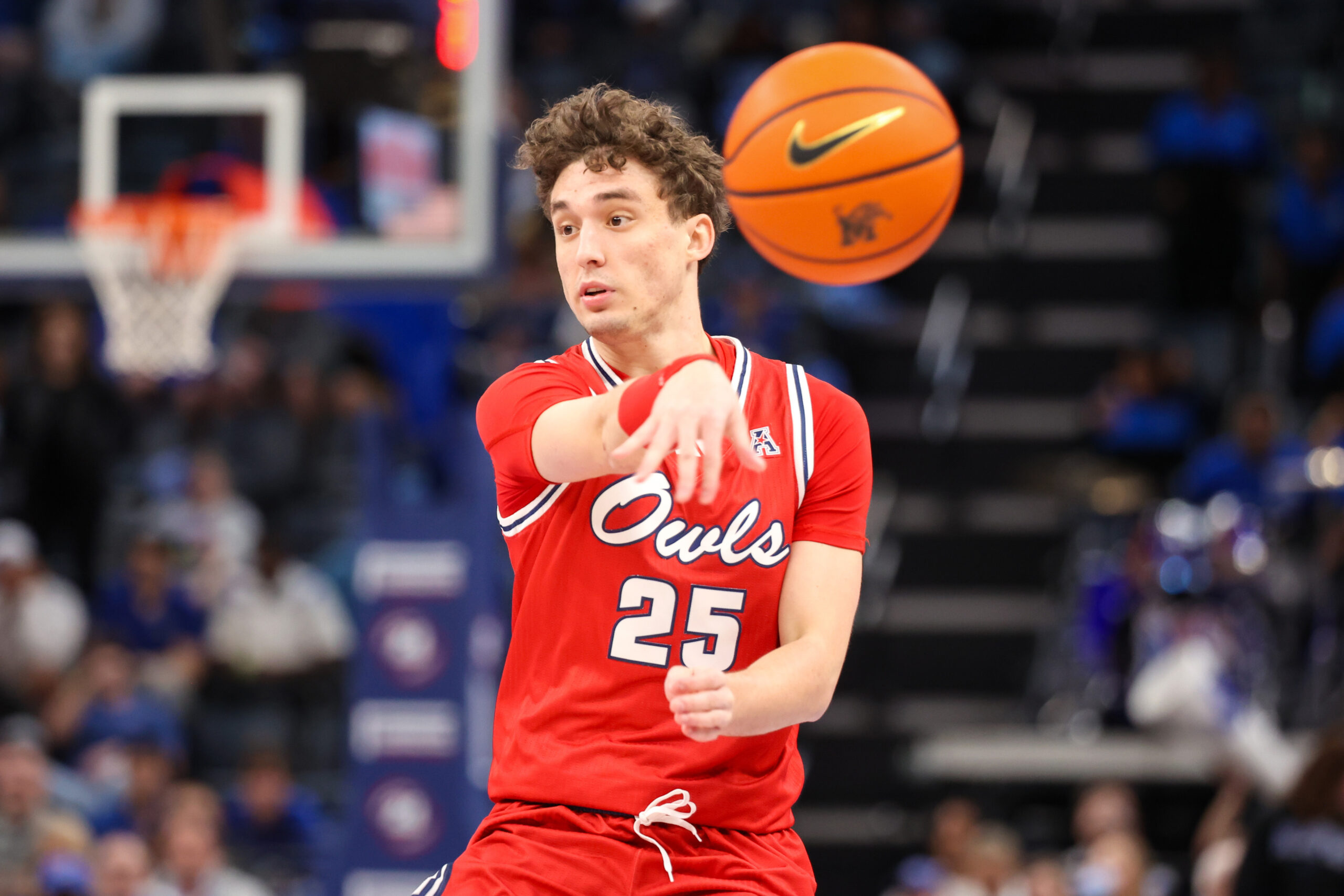 Feb 23, 2025; Memphis, Tennessee, USA; Florida Atlantic Owls guard Niccolo Moretti (25) passes against the Memphis Tigers during the second half at FedExForum. Mandatory Credit: Wesley Hale-Imagn Images