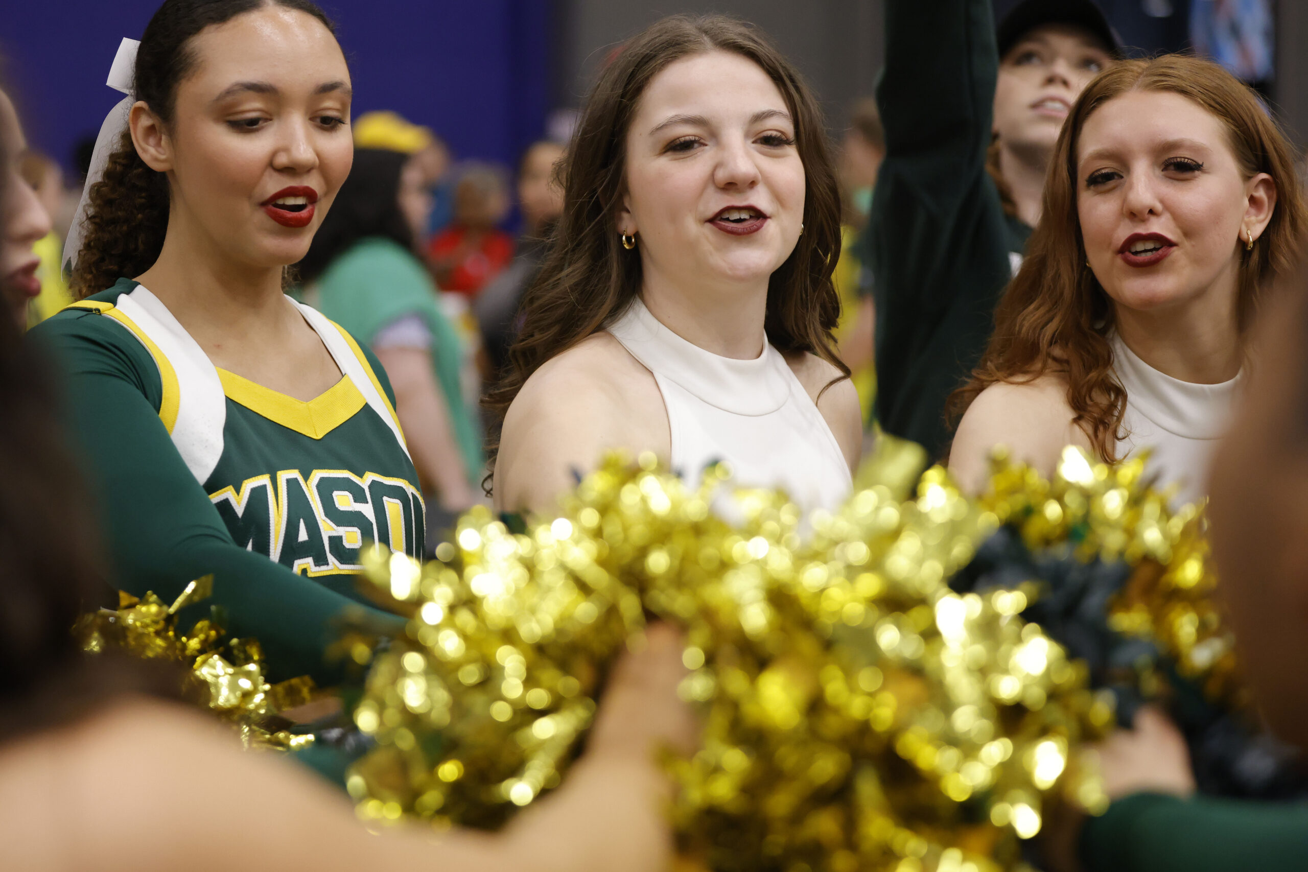 Mar 8, 2025; Henrico, VA, USA; George Mason Patriots cheerleaders and dance team members huddle after the Patriots’ defeated the Davidson Wildcats at Henrico Sports & Events Center. Mandatory Credit: Amber Searls-Imagn Images