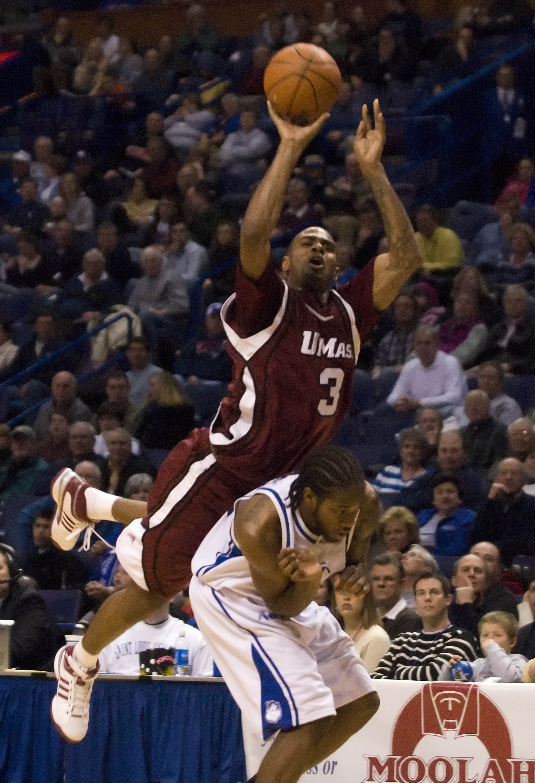 Feb 2, 2008; St, Louis, MO, USA; Massachusetts Minutemens guard/forward Gary Forbes (3) puts up a three pointer and is fouled by Saint Louis Billikens guard Tommie Liddell (25) during the 2nd half at the Scottrade Center. Saint Louis went on to defeat Massachusetts 71-59.  Mandatory Credit: Jeff Curry-Imagn Images