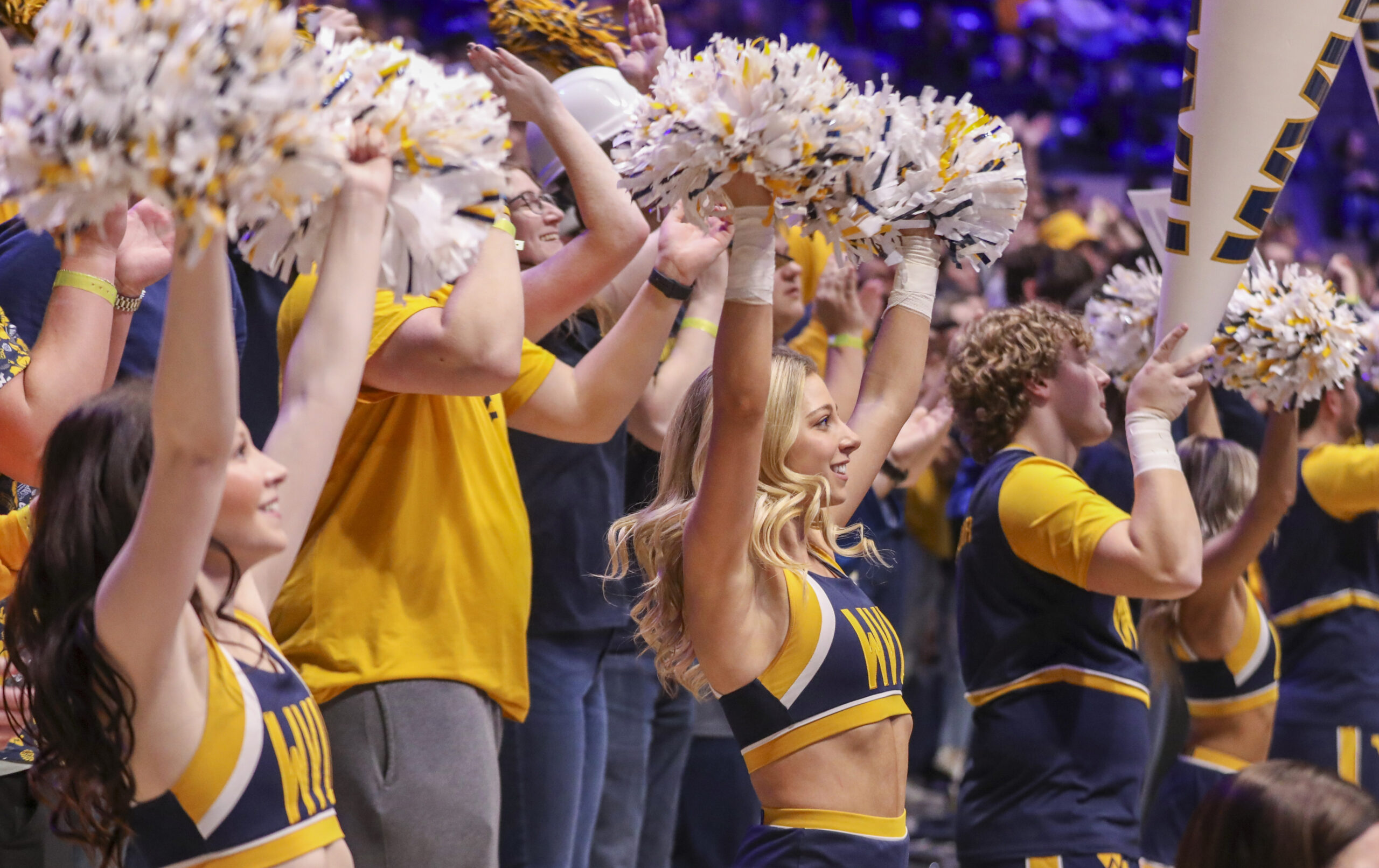 Mar 8, 2025; Morgantown, West Virginia, USA; West Virginia Mountaineers cheerleaders perform during the second half against the UCF Knights at WVU Coliseum. Mandatory Credit: Ben Queen-Imagn Images