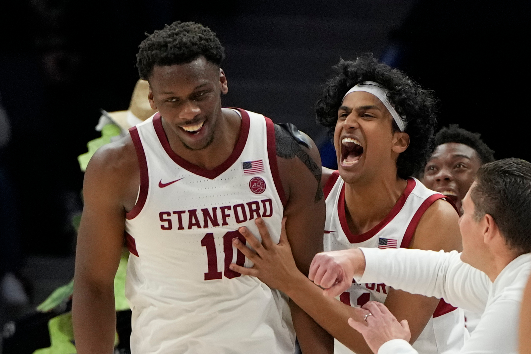 Mar 12, 2025; Charlotte, NC, USA; Stanford Cardinal forward Chisom Okpara (10) reacts with guard Ryan Agarwal (11) after scoring a basket and being fouled late in the second half at Spectrum Center. Mandatory Credit: Bob Donnan-Imagn Images