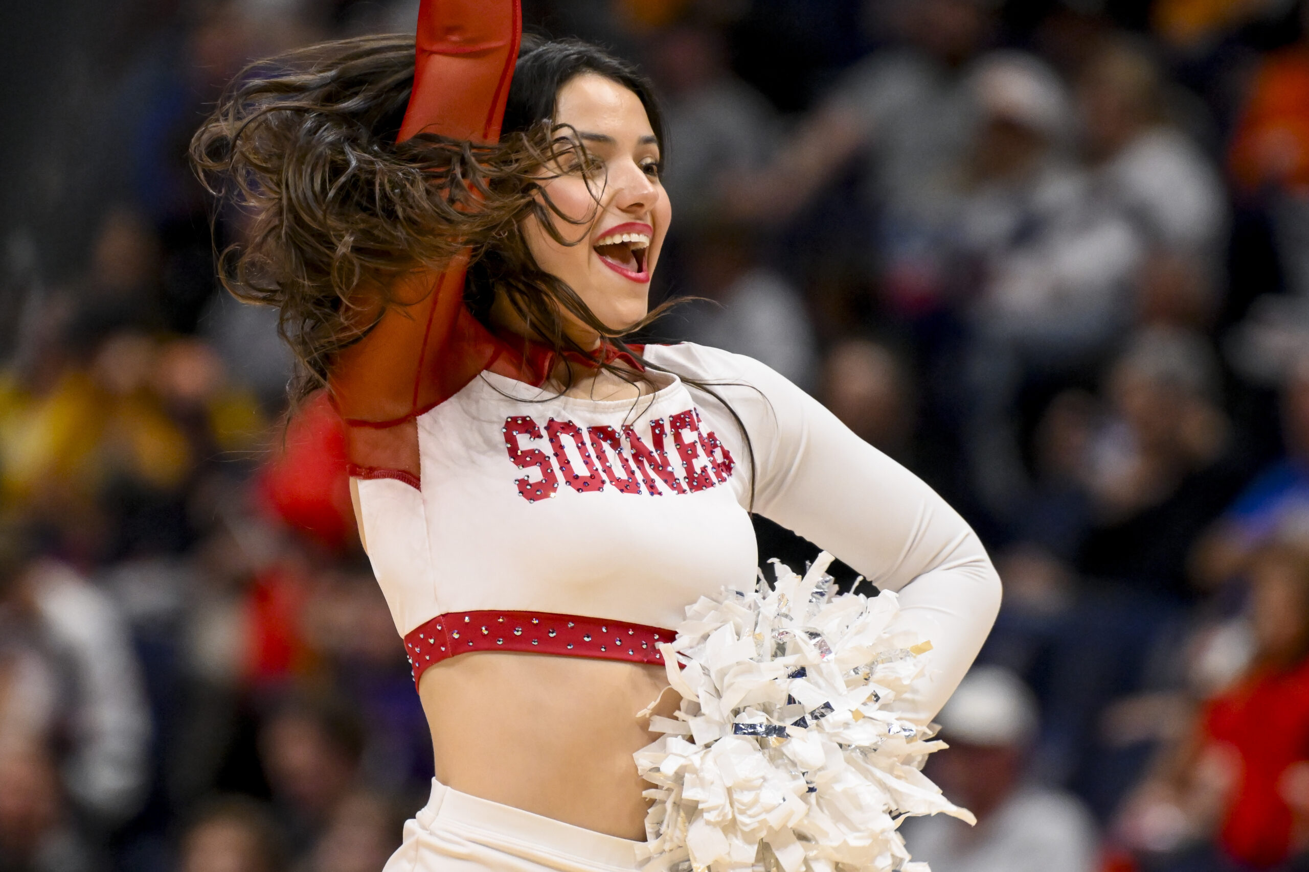 Mar 12, 2025; Nashville, TN, USA; Oklahoma Sooners cheerleader during a time out against the Georgia Bulldogs during the second half at Bridgestone Arena. Mandatory Credit: Steve Roberts-Imagn Images