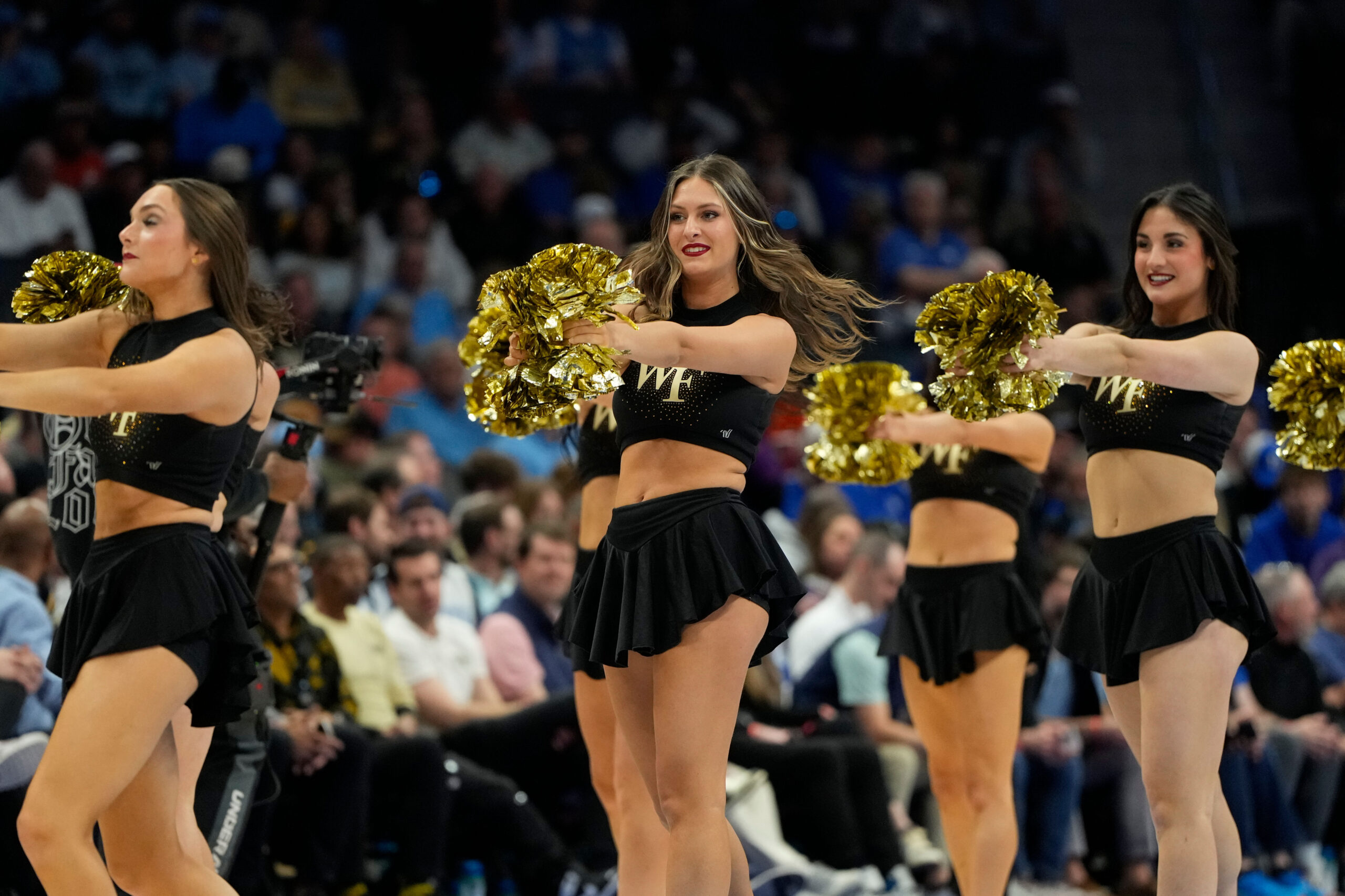 Mar 13, 2025; Charlotte, NC, USA; Wake Forest Demon Deacons cheerleaders perform in the second half at Spectrum Center. Mandatory Credit: Bob Donnan-Imagn Images