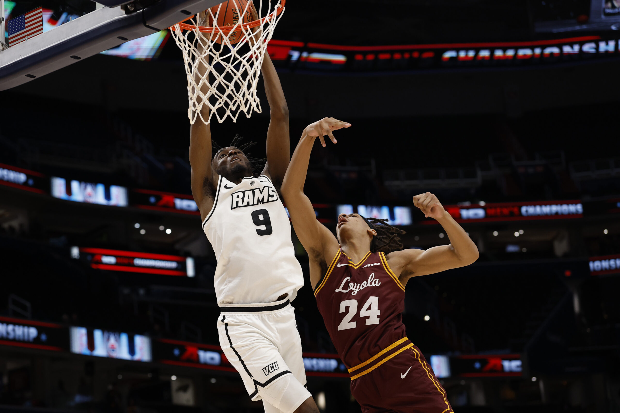 Mar 15, 2025; Washington, D.C., USA; VCU Rams forward Luke Bamgboye (9) is fouled while attempting to dunk the ball by Loyola Chicago Ramblers center Miles Rubin (24) in the second half at Capital One Arena. Mandatory Credit: Geoff Burke-Imagn Images