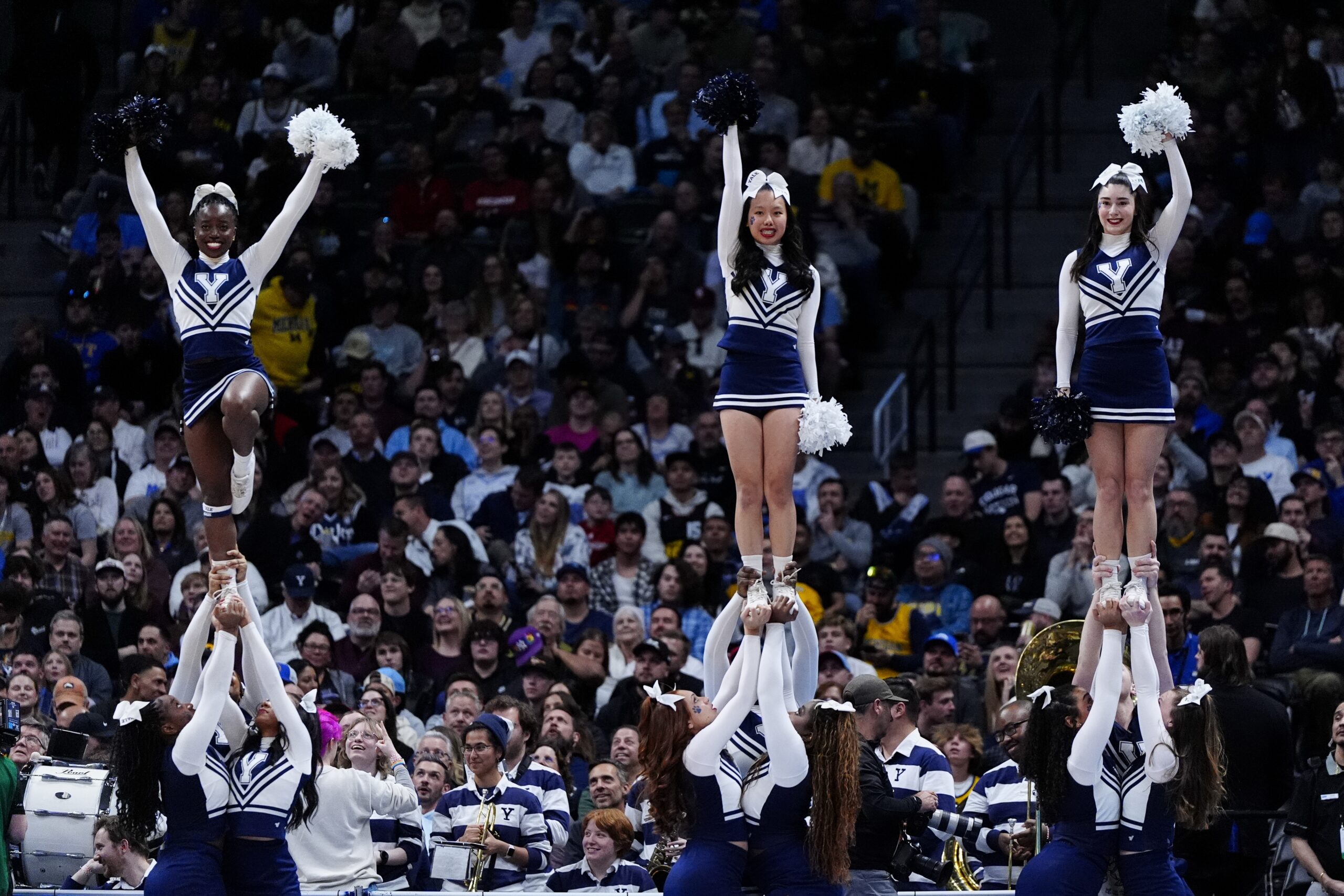 March 20, 2025; Denver, CO, USA; Yale Bulldogs cheerleaders preforms during half-time against the Texas A&M Aggies at Ball Arena. Mandatory Credit: Ron Chenoy-Imagn Images