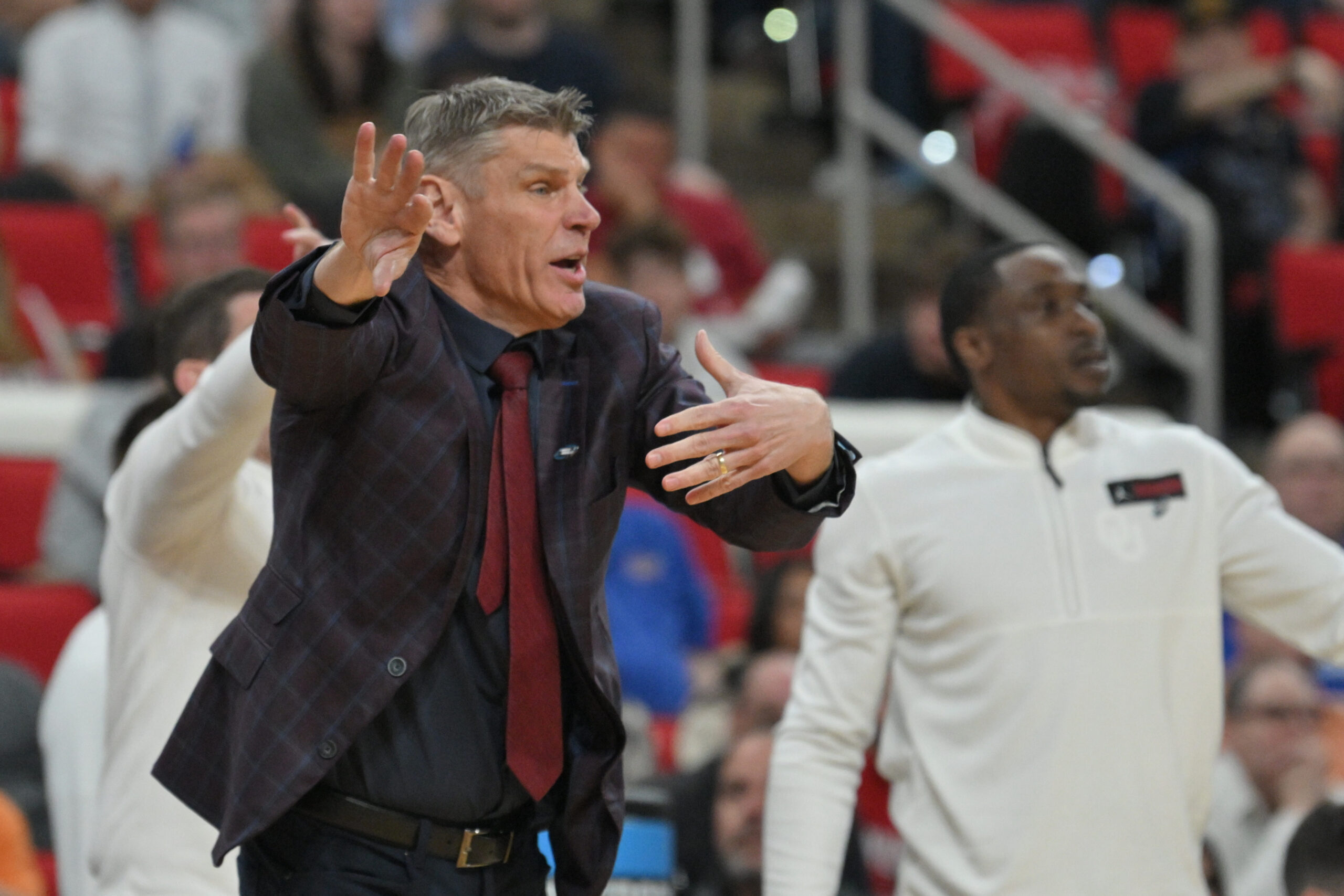 Mar 21, 2025; Raleigh, NC, USA;  Oklahoma Sooners head coach Porter Moser reacts during the second half against the Connecticut Huskies at Lenovo Center. Mandatory Credit: Zachary Taft-Imagn Images