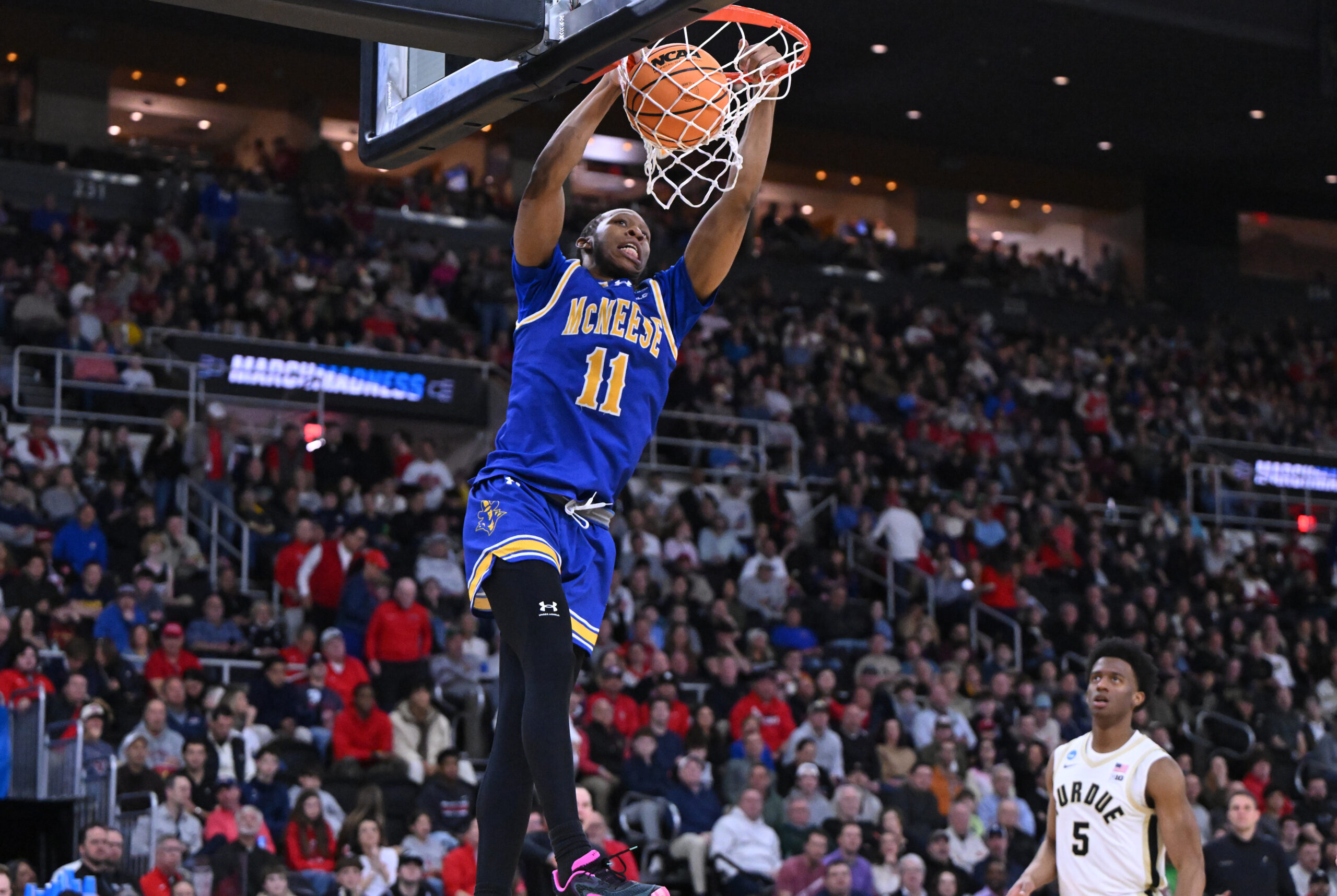 Mar 22, 2025; Providence, RI, USA; McNeese State Cowboys guard Quadir Copeland (11) dunks during the second half of a second round men’s NCAA Tournament game against the Purdue Boilermakers at Amica Mutual Pavilion. Mandatory Credit: Brian Fluharty-Imagn Images