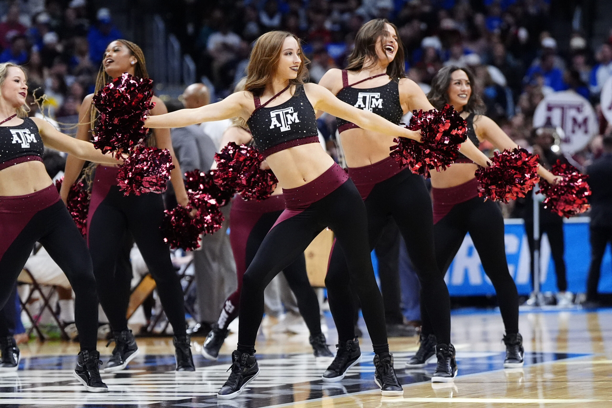 Mar 22, 2025; Denver, CO, USA; Texas A&M Aggies cheerleaders perform during the first half in the second round of the NCAA Tournament at Ball Arena. Mandatory Credit: Ron Chenoy-Imagn Images