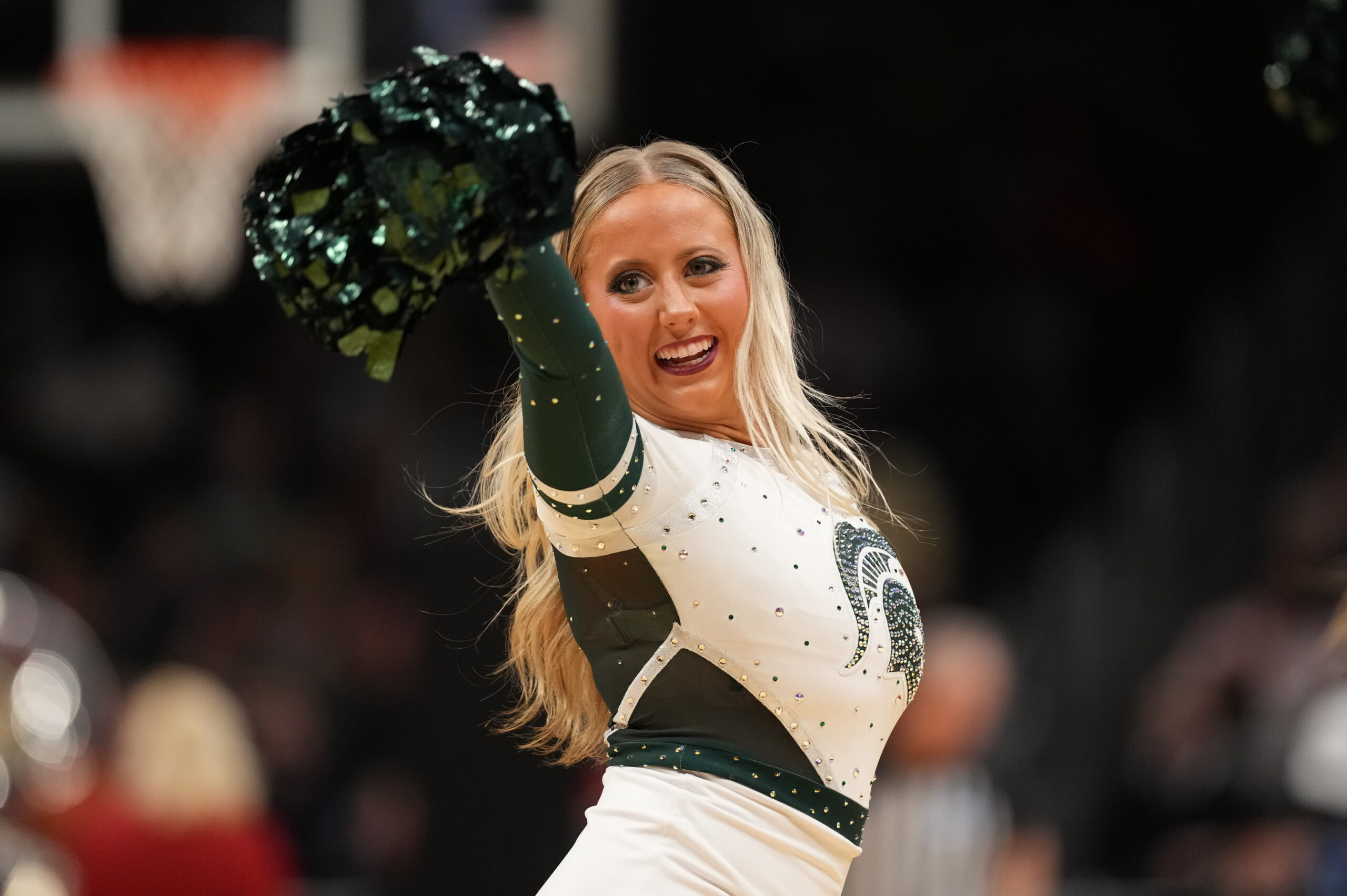 Mar 28, 2025; Atlanta, GA, USA; Michigan State Spartans cheerleaders in the second half of a South Regional semifinal of the 2025 NCAA tournament against the Mississippi Rebels at State Farm Arena. Mandatory Credit: Dale Zanine-Imagn Images