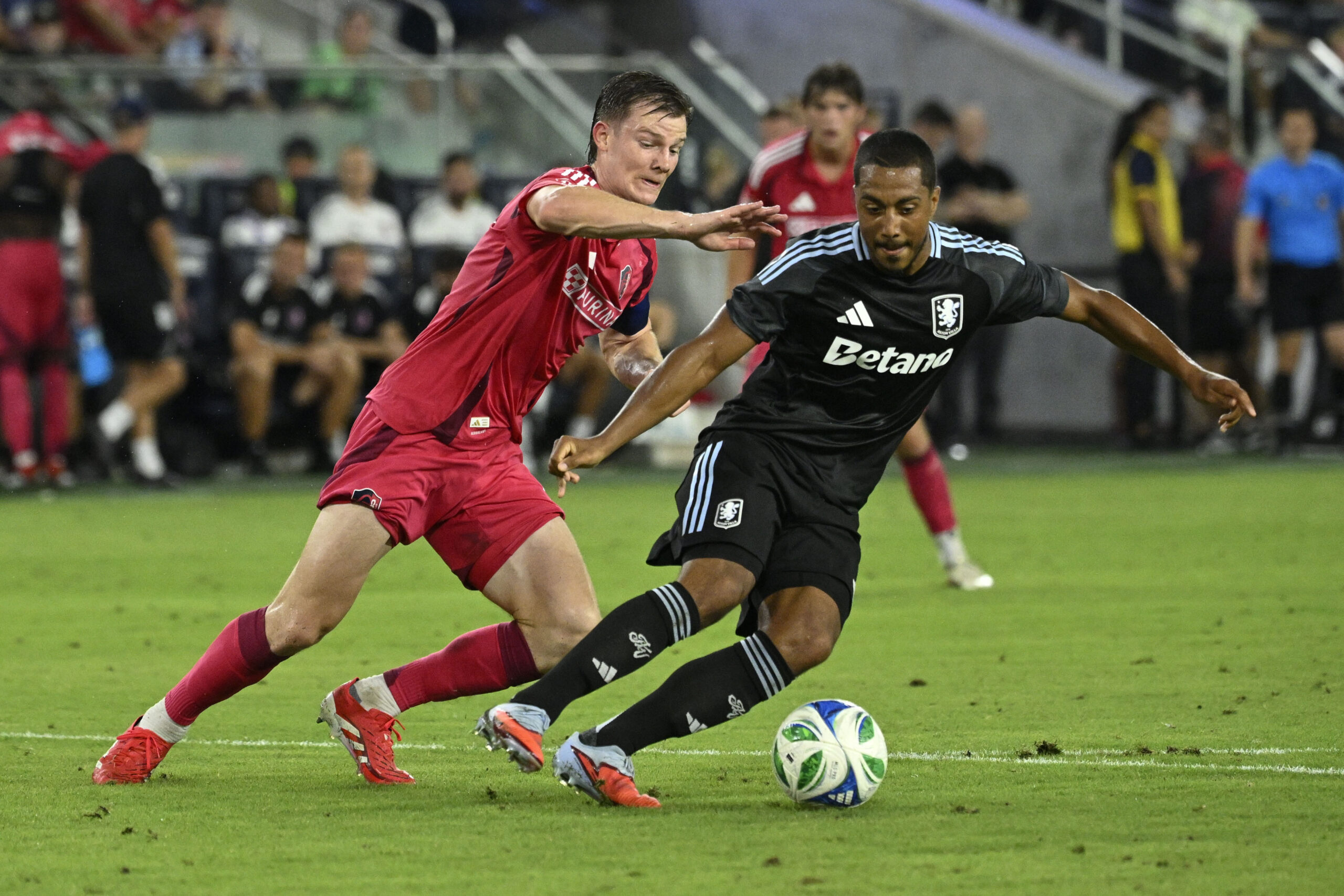 Jul 30, 2025; St. Louis, Missouri, USA; St. Louis City midfielder Chris Durkin (8) battles Aston Villa midfielder Youri Tielemans (8) for the ball in the second half at Energizer Park. Mandatory Credit: Joe Puetz-Imagn Images