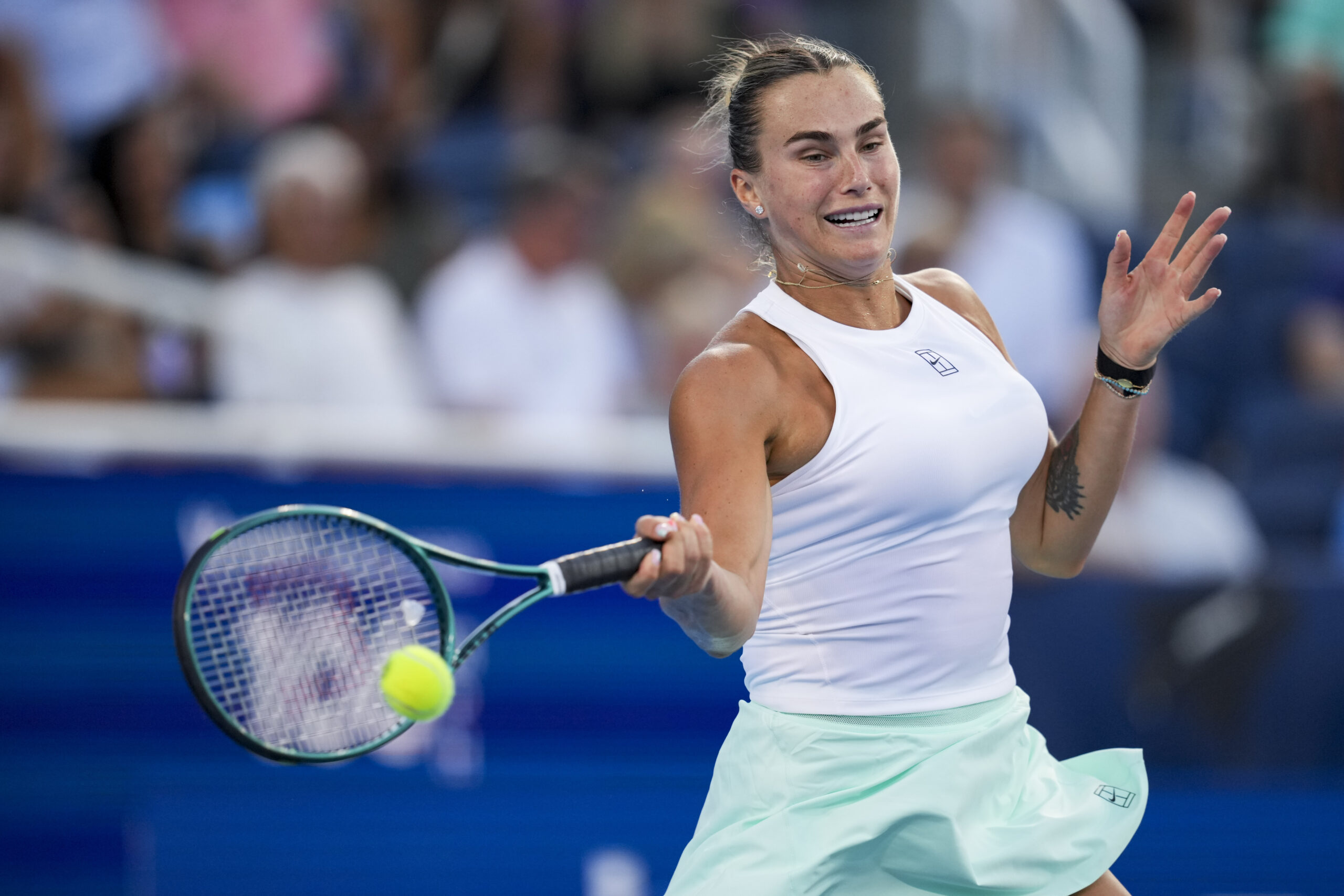 Aug 9, 2025; Cincinnati, OH, USA; Aryna Sabalenka (BLR) returns a shot against Marketa Vondrousova (CZE) during the Cincinnati Open at the Lindner Family Tennis Center. Mandatory Credit: Aaron Doster-Imagn Images