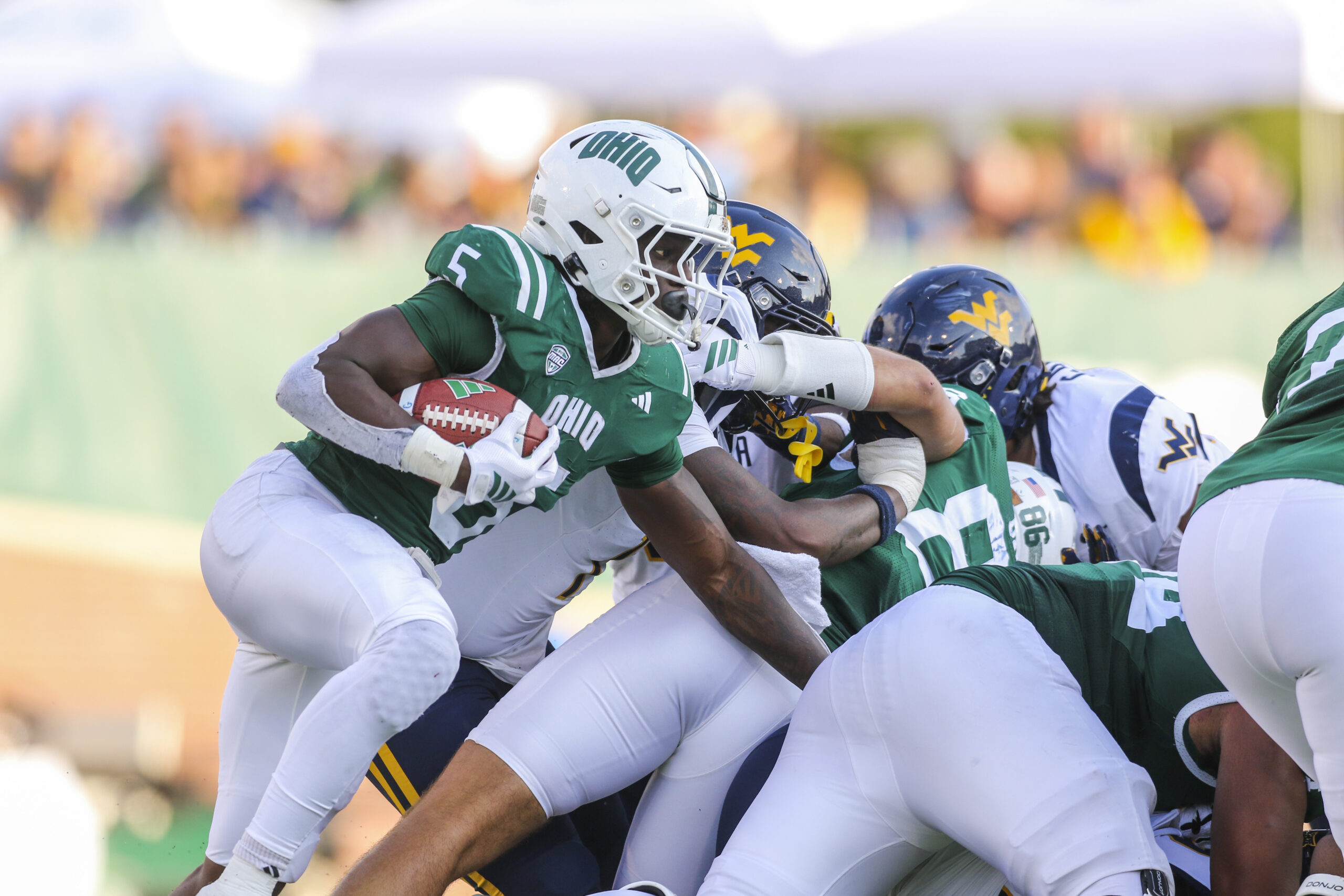 Sep 6, 2025; Athens, Ohio, USA; Ohio Bobcats running back Sieh Bangura (5) runs the ball during the third quarter against the West Virginia Mountaineers at Peden Stadium. Mandatory Credit: Ben Queen-Imagn Images