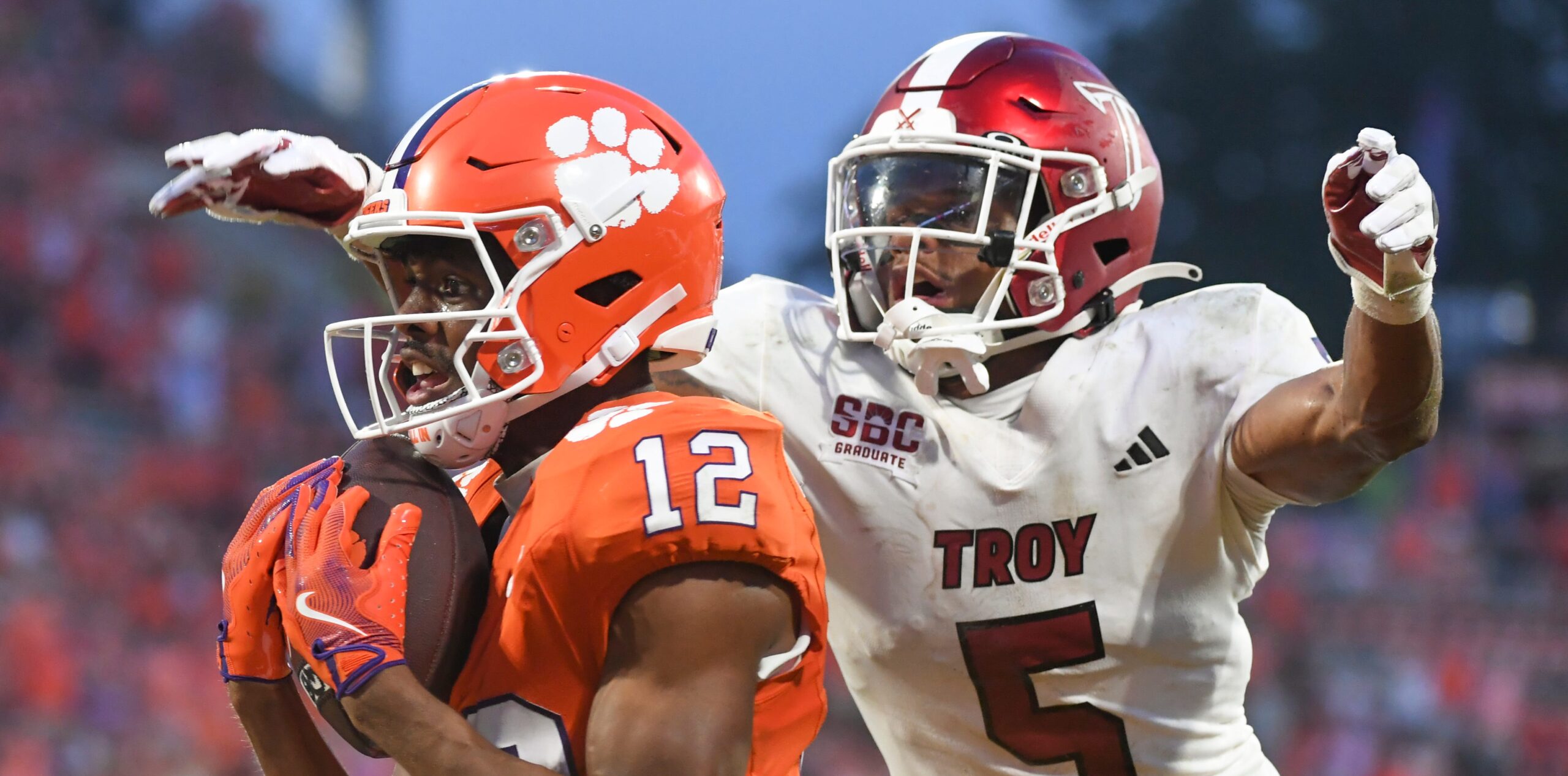 Clemson Tigers wide receiver Bryant Wesco Jr. (12) catches a pass for a touchdown while being defended by Troy Trojans cornerback Kaleno Levine (5) Saturday, Sept. 6, 2025 during the NCAA football game at Memorial Stadium in Clemson, South Carolina.