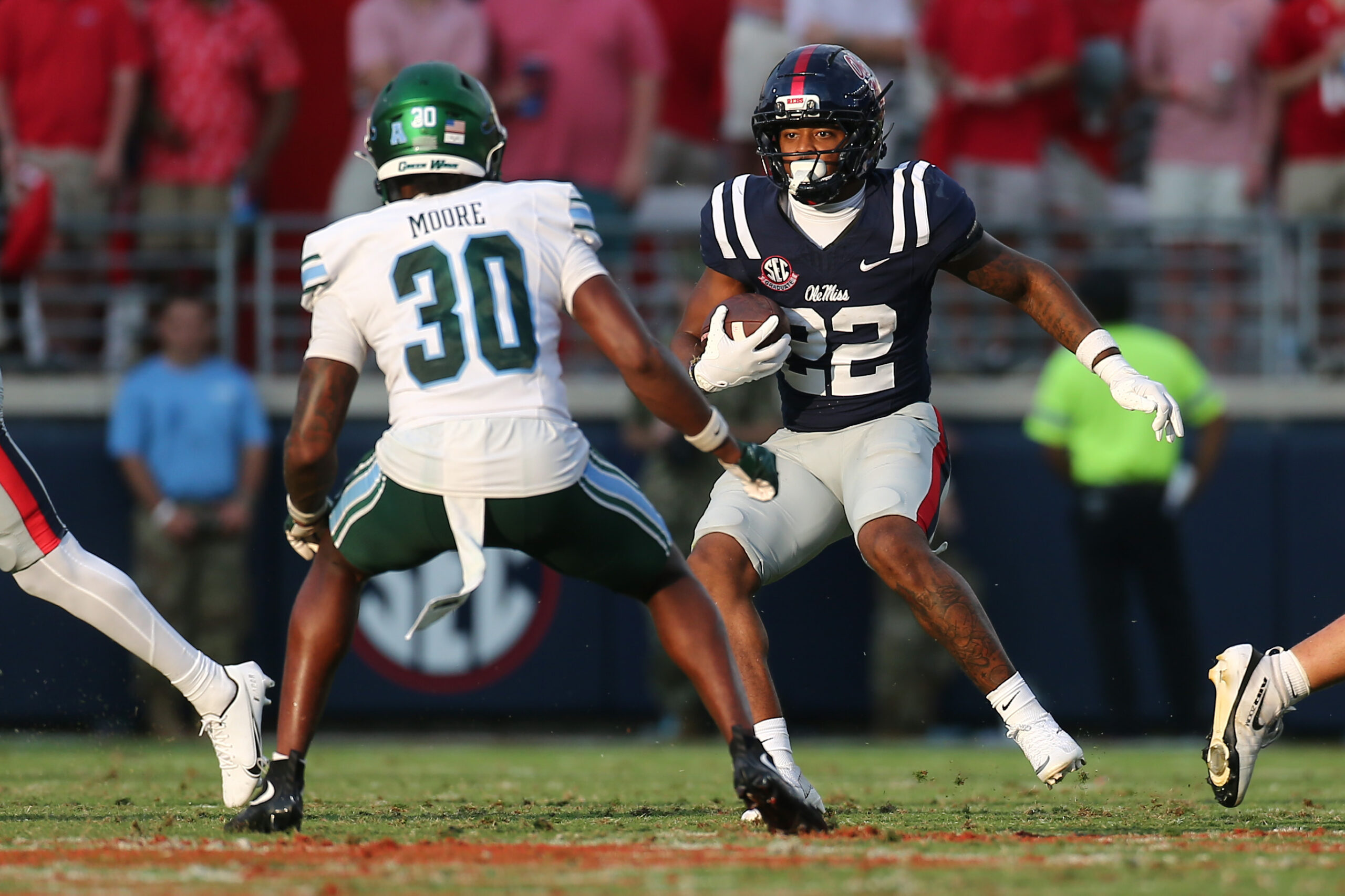 Sep 20, 2025; Oxford, Mississippi, USA; Mississippi Rebels running back Logan Diggs (22) runs the ball during the fourth quarter against the Tulane Green Wave at Vaught-Hemingway Stadium. Mandatory Credit: Petre Thomas-Imagn Images
