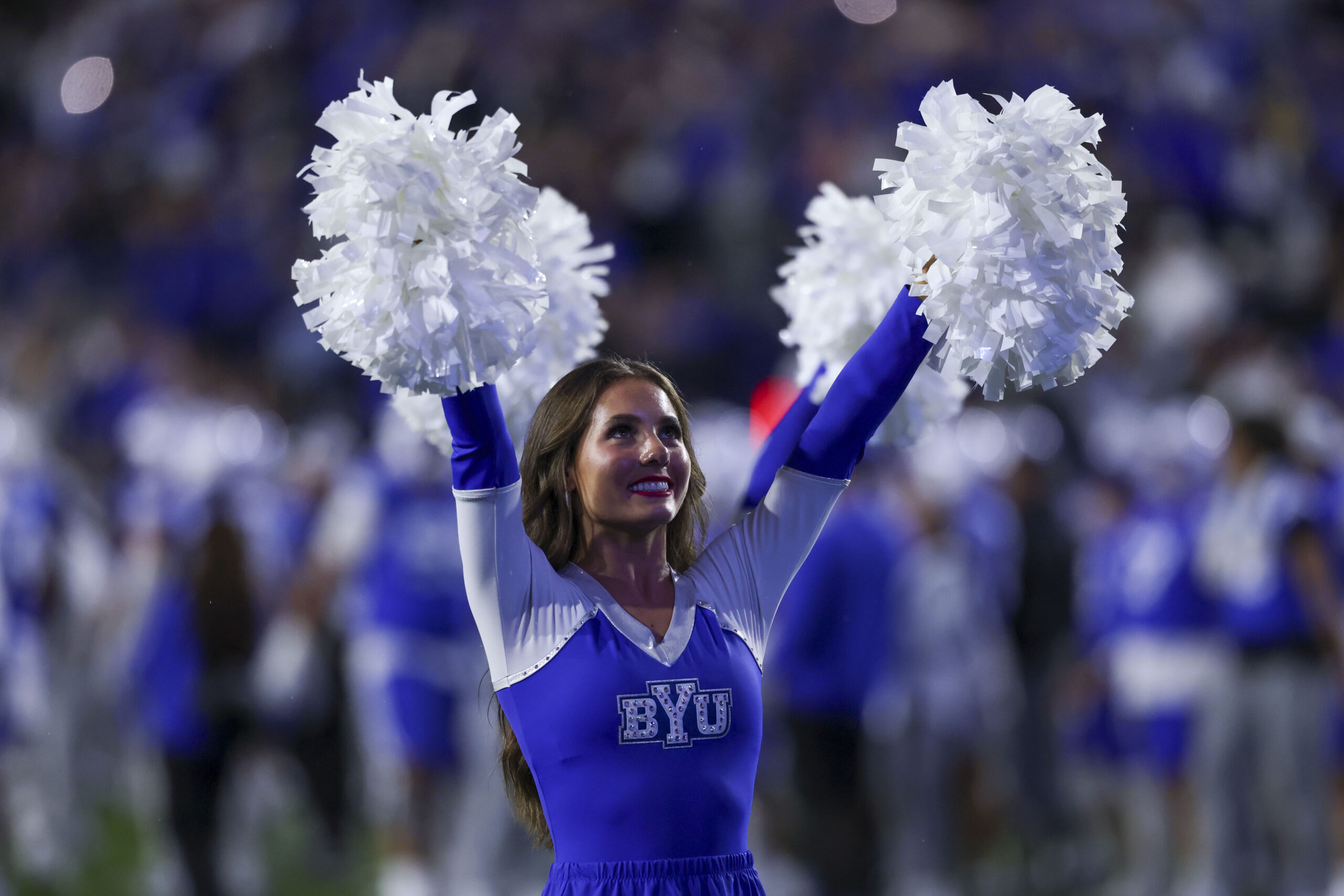 Oct 3, 2025; Provo, Utah, USA; A. Brigham Young Cougars cheerleader performs between the third and fourth quarter of the game against the West Virginia Mountaineers at LaVell Edwards Stadium. Mandatory Credit: Rob Gray-Imagn Images