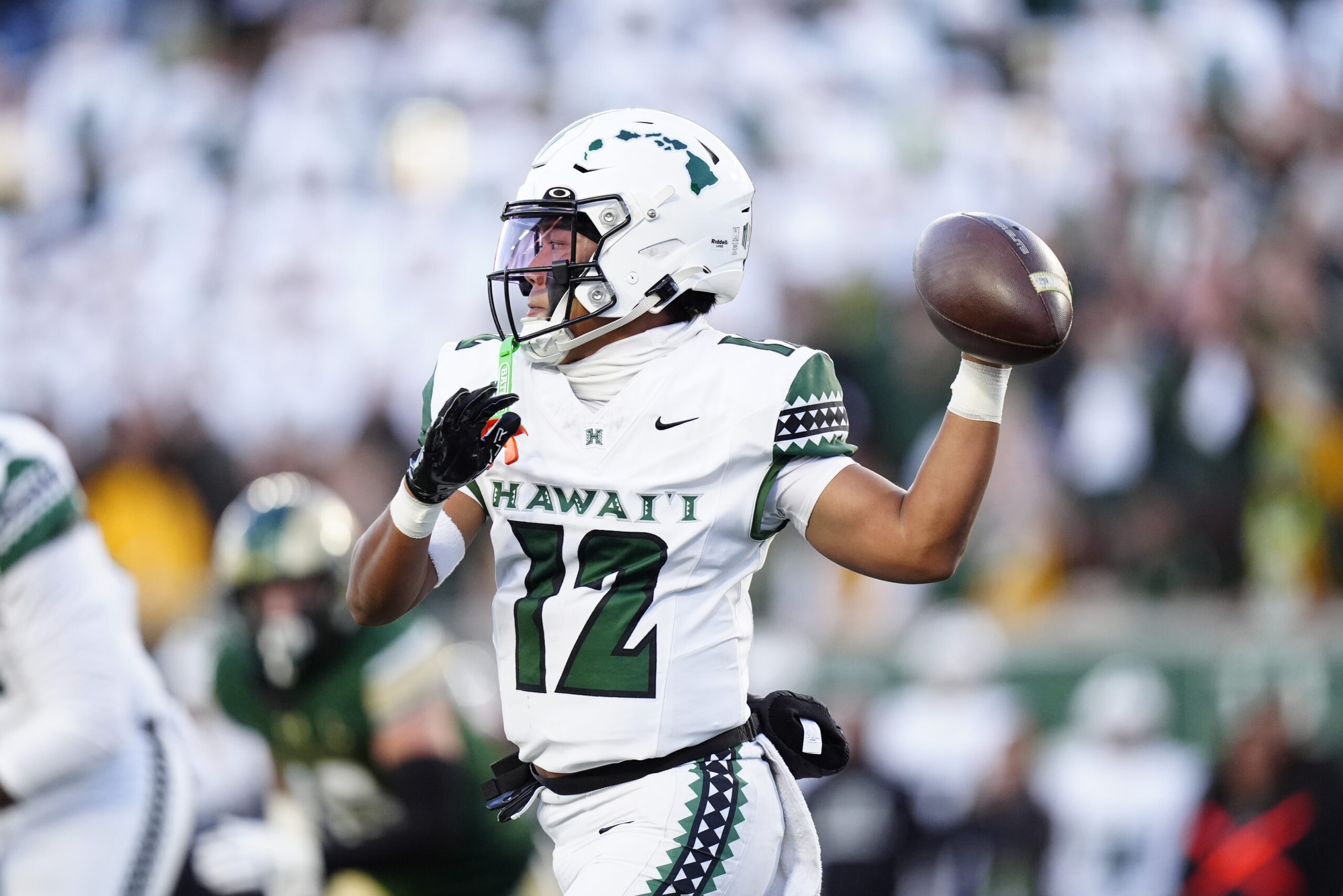 Oct 18, 2025; Fort Collins, Colorado, USA; Hawaii Rainbow Warriors quarterback Micah Alejado (12) prepares to pass against the Colorado State Rams in the first quarter at Sonny Lubick Field at Canvas Stadium. Mandatory Credit: Ron Chenoy-Imagn Images