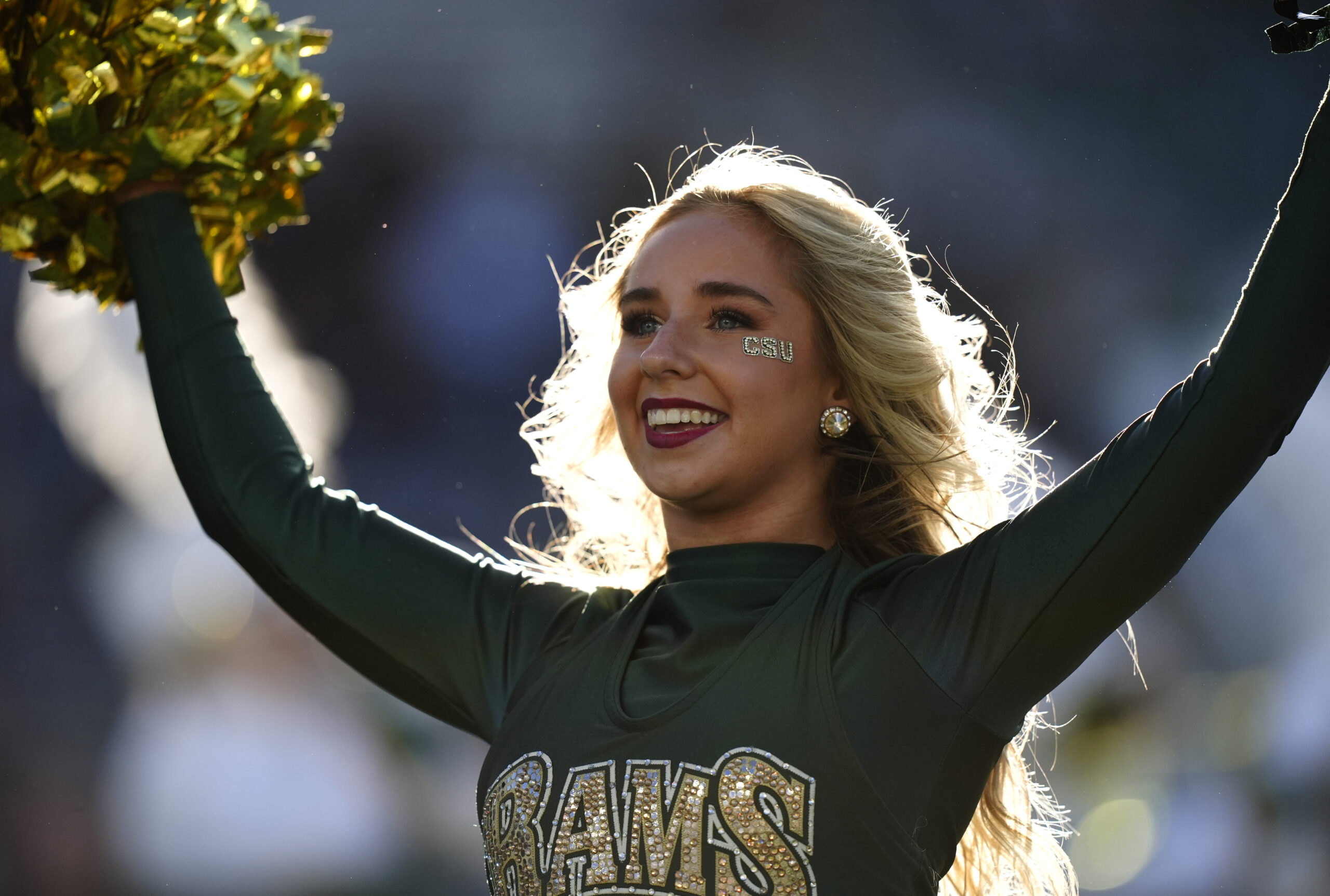 Oct 18, 2025; Fort Collins, Colorado, USA; Colorado State Rams cheerleader performs in the first quarter against the Hawaii Rainbow Warriors at Sonny Lubick Field at Canvas Stadium. Mandatory Credit: Ron Chenoy-Imagn Images