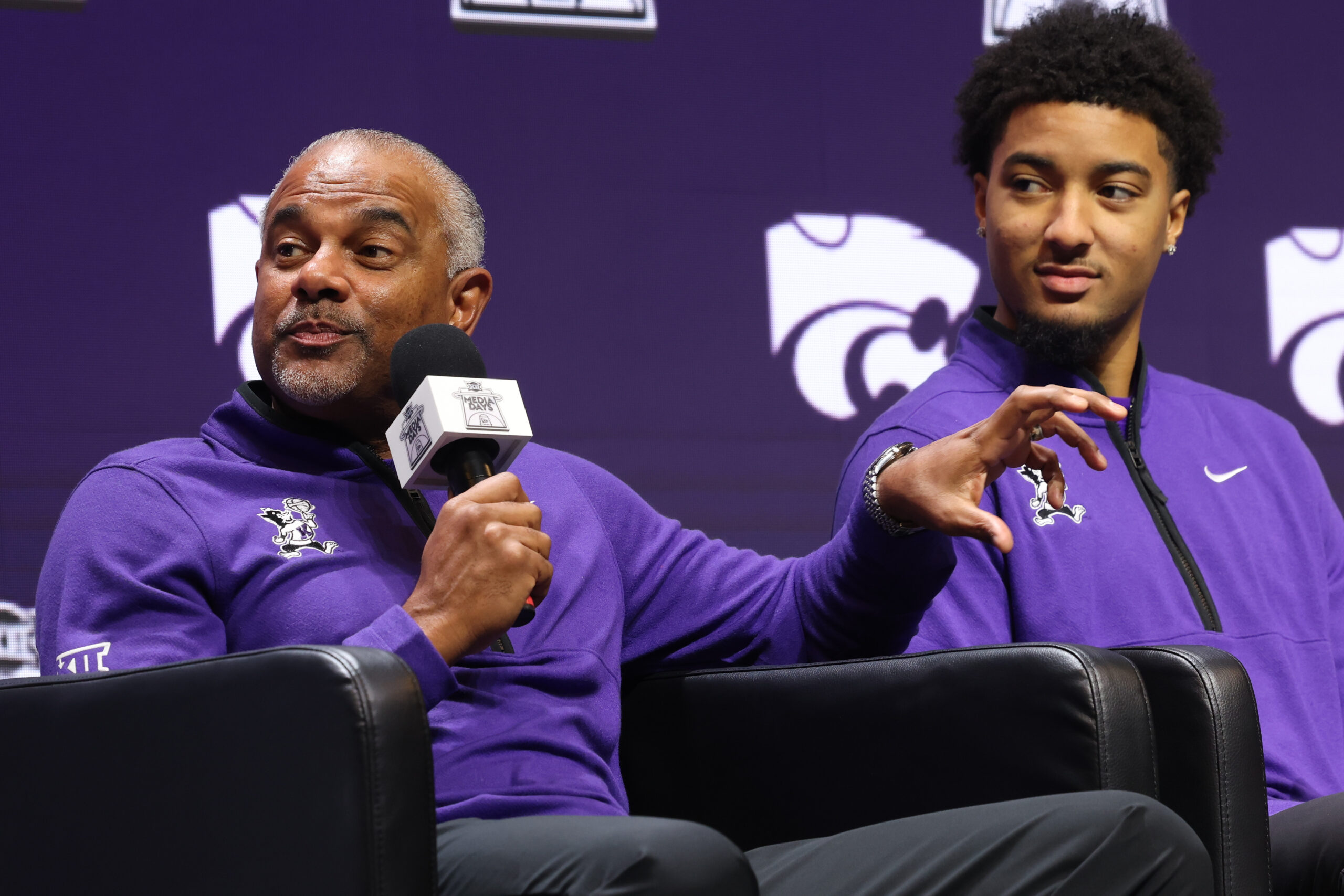 Oct 22, 2025; Kansas City, MO, USA; (From left) Kansas State head coach Jerome Tang and PJ Haggerty speak to media during Big 12 media day at T-Mobile Center. Mandatory Credit: Sophia Scheller-Imagn Images