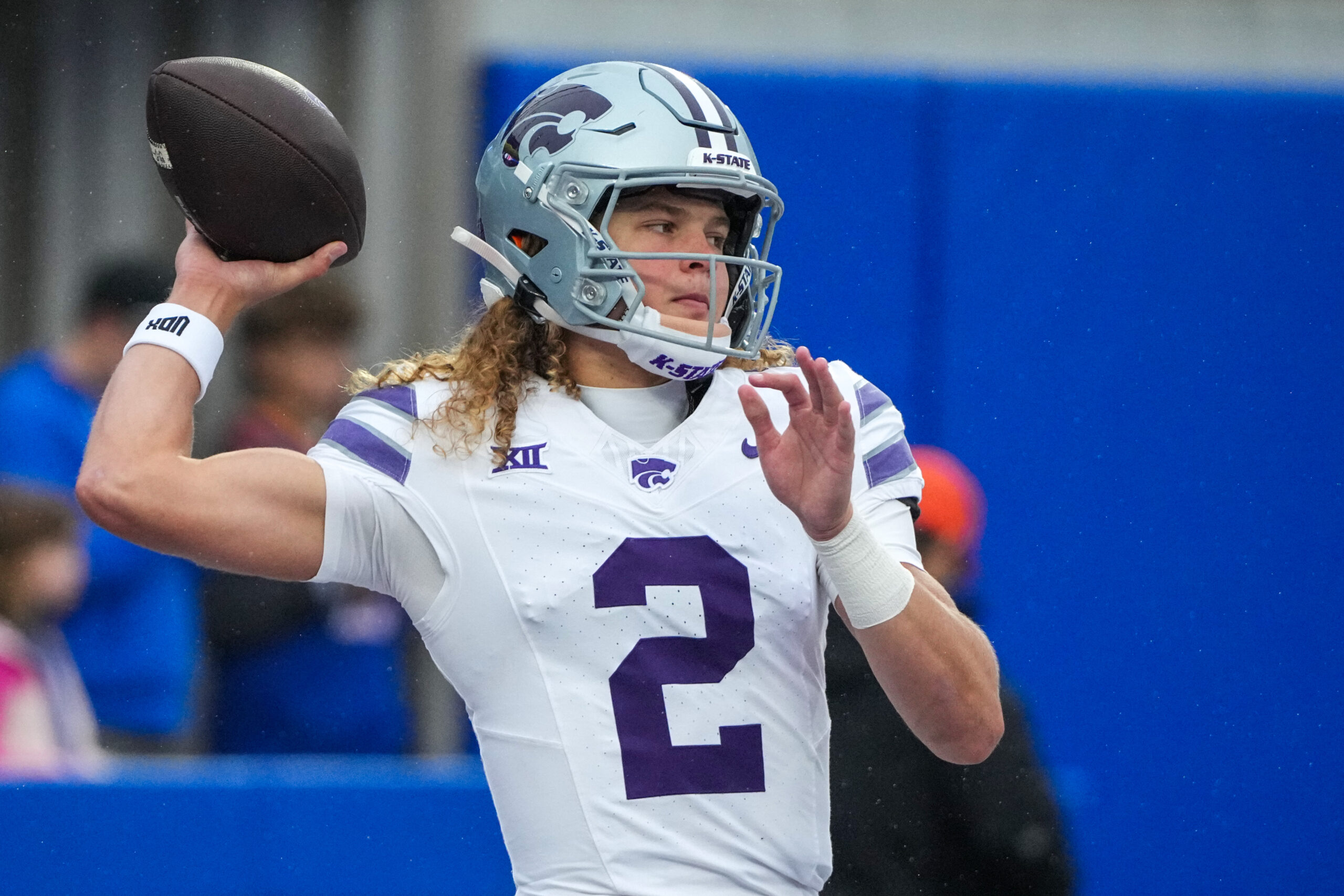 Oct 25, 2025; Lawrence, Kansas, USA; Kansas State Wildcats quarterback Avery Johnson (2) warms up against the Kansas Jayhawks prior to a game at David Booth Kansas Memorial Stadium. Mandatory Credit: Denny Medley-Imagn Images