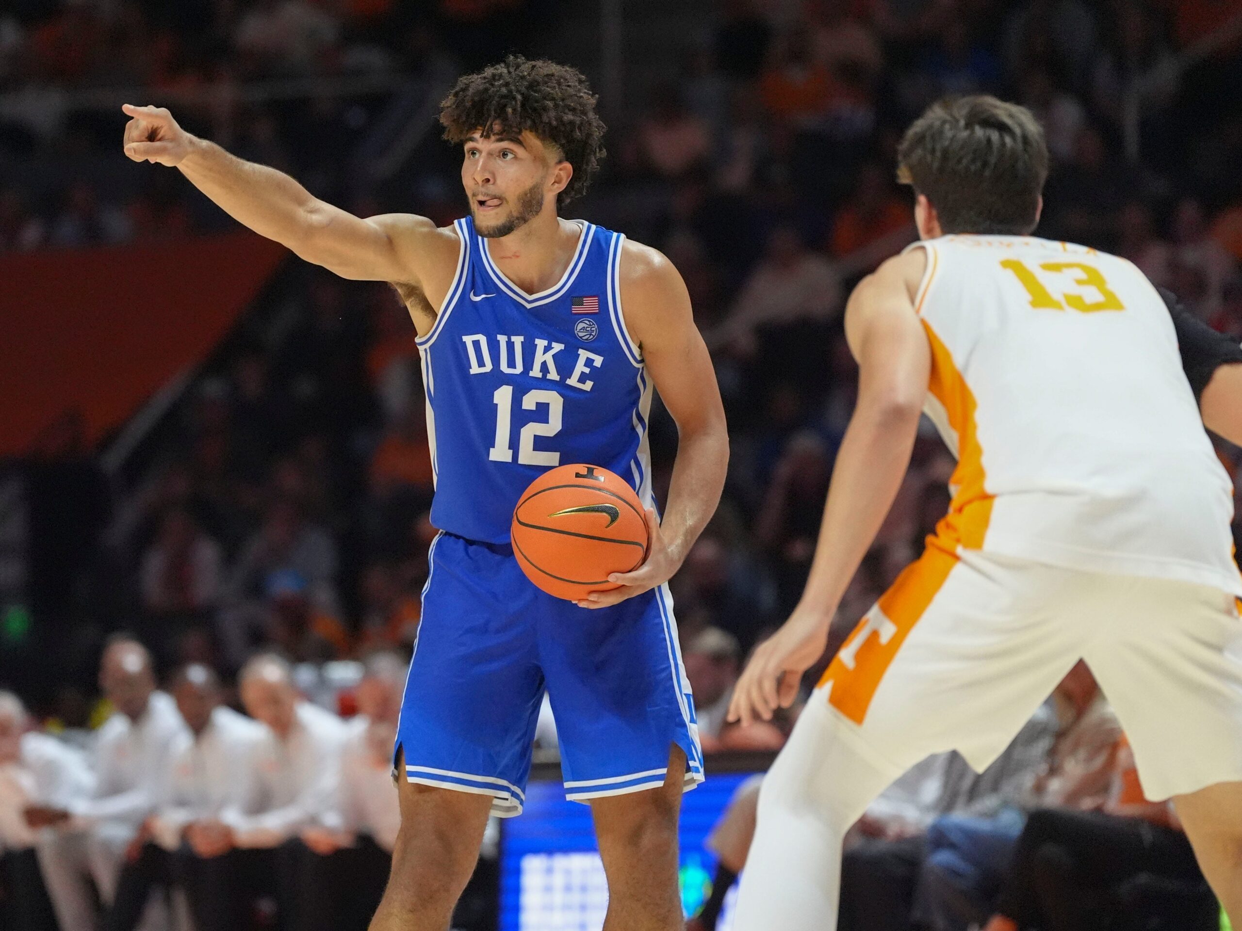 Duke forward Cameron Boozer (12) sends out instructions while guarded by Tennessee forward J.P. Estrella (13) during a college basketball exhibition game between on October 26, 2025, in Knoxville, Tenn.