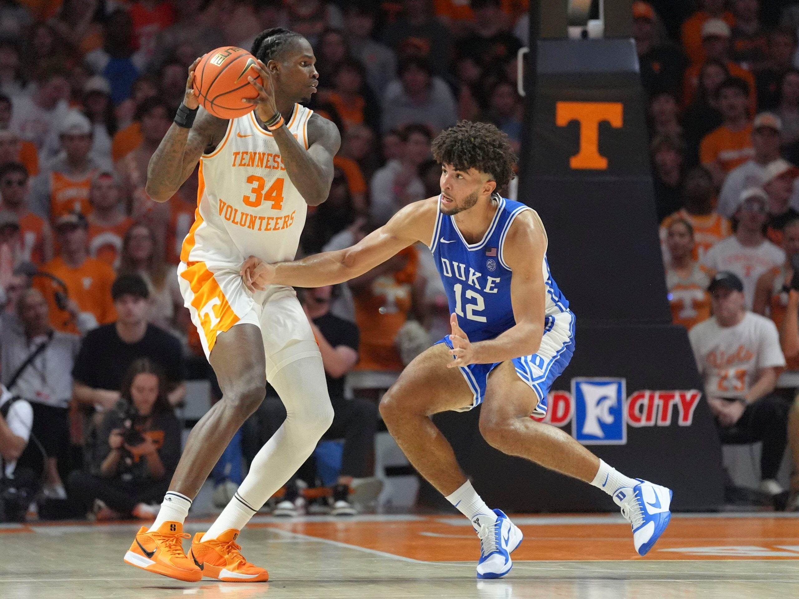 Tennessee forward Felix Okpara (34) tries to moves the ball while guarded by Duke forward Cameron Boozer (12) in a college basketball exhibition game on October 26, 2025, in Knoxville, Tenn.