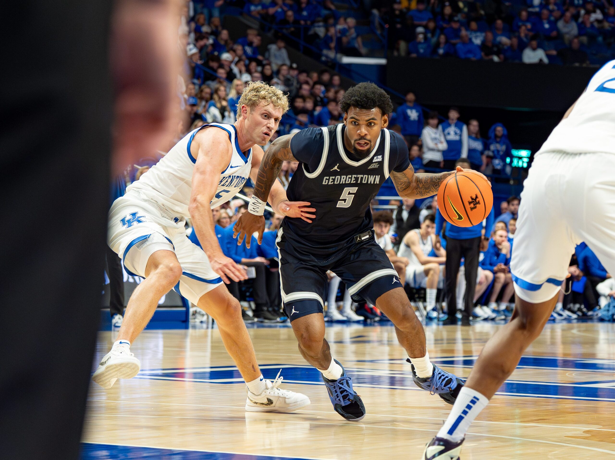 Georgetown’s KJ Lewis (5) drove to the basket for a score as the Kentucky Wildcats host the Georgetown Hoyas at Rupp Arena in Lexington on Thursday, Oct. 30, 2025.