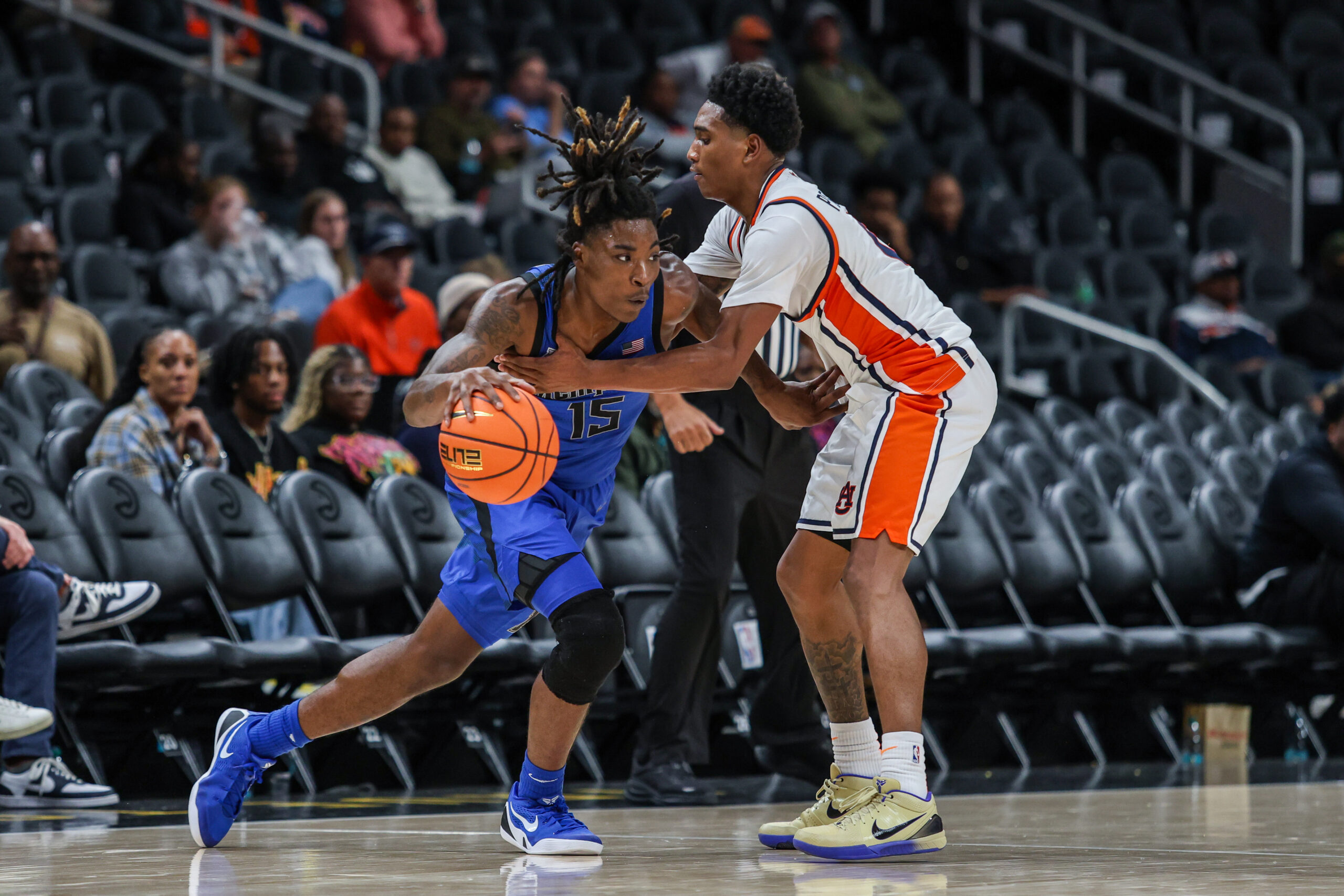 Oct 30, 2025; Atlanta, GA, USA; Memphis Tigers guard Julius Thedford (15) drives the ball toward the basket against Auburn Tigers guard Tahaad Pettiford (0) during the second half at State Farm Arena. Mandatory Credit: Jordan Godfree-Imagn Images